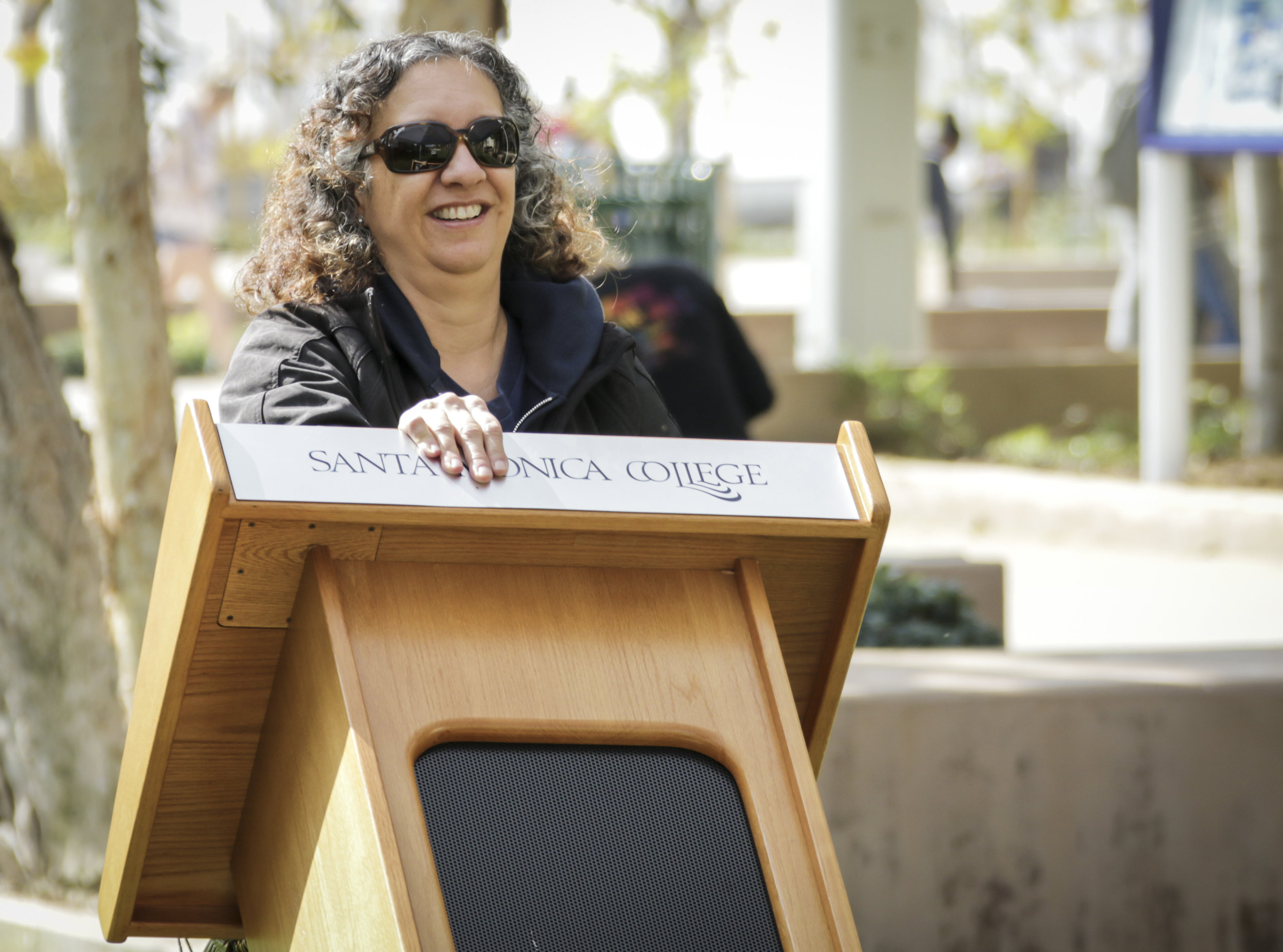 Santa Monica College event technician Carol Evans placing the podium for the Associated Students candidates before the AS elections debate held at the quad of the main campus in Santa Monica, California, Tuesday, April 3, 2018. (Ashutosh Bikram Singh/Corsair Photo)
