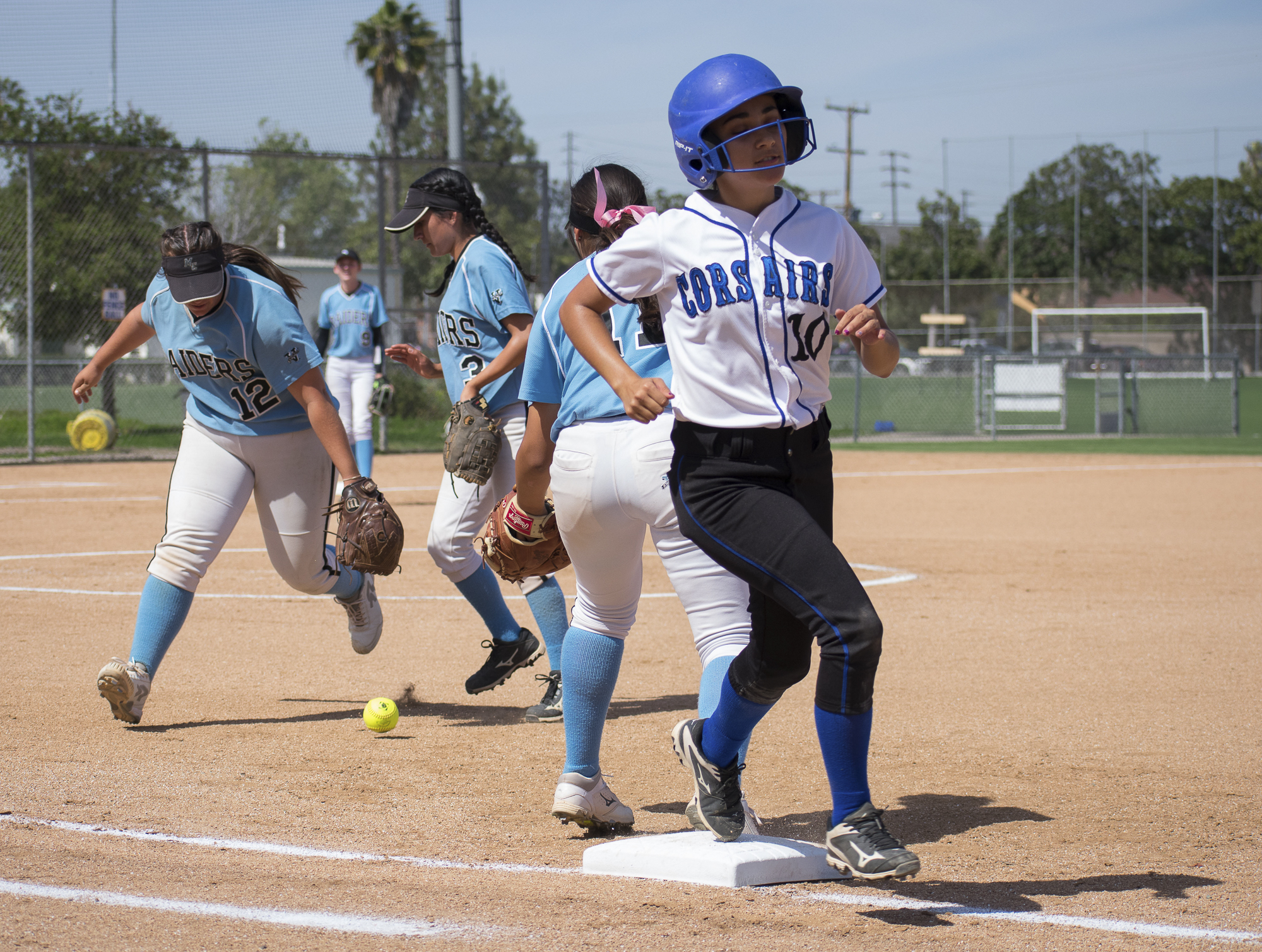 Santa Monica Corsairs Briana Osuna (#10) runs past first base during a softball game against the Moorpark College Raiders on Tuesday, April 10 at the John Adams Middle School Field in Santa Monica, California. The game ended with an 11-8 loss for the Corsairs, further continuing their six-game loss. (Ethan Lauren/Corsair Photo)