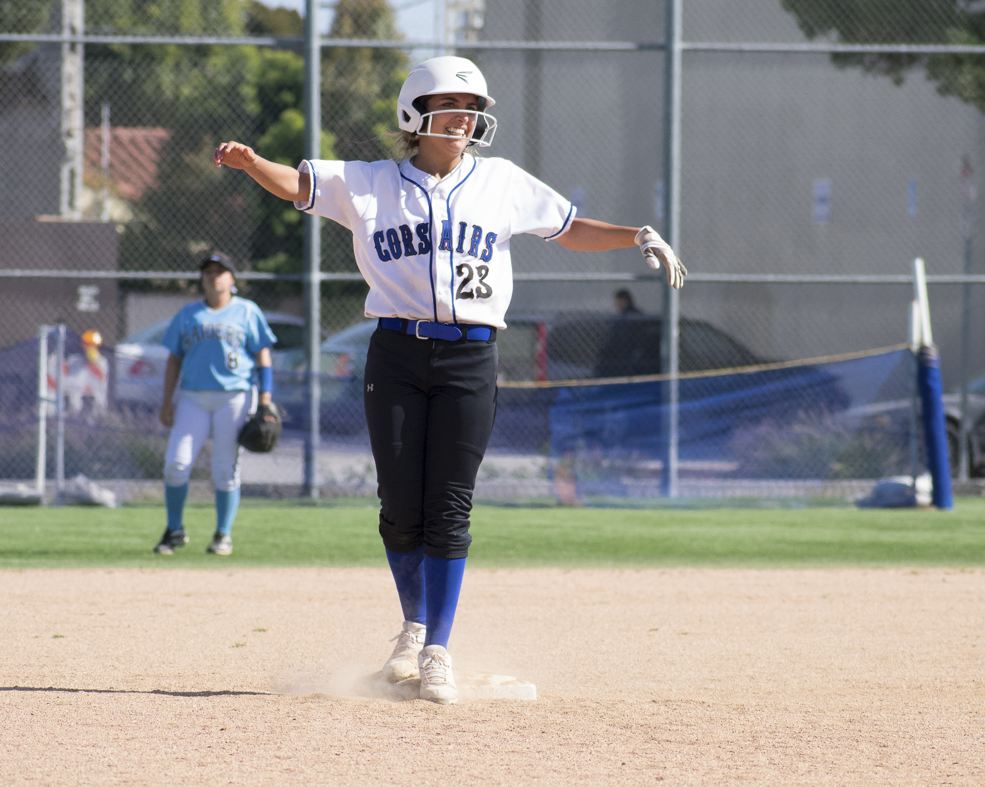 Santa Monica Corsairs Taylor Liebesman (#23) stops at second base during a softball game against the Moorpark College Raiders on Tuesday, April 10 at the John Adams Middle School Field in Santa Monica, California. The game ended with an 11-8 loss for the Corsairs, further continuing their six-game loss. (Ethan Lauren/Corsair Photo)