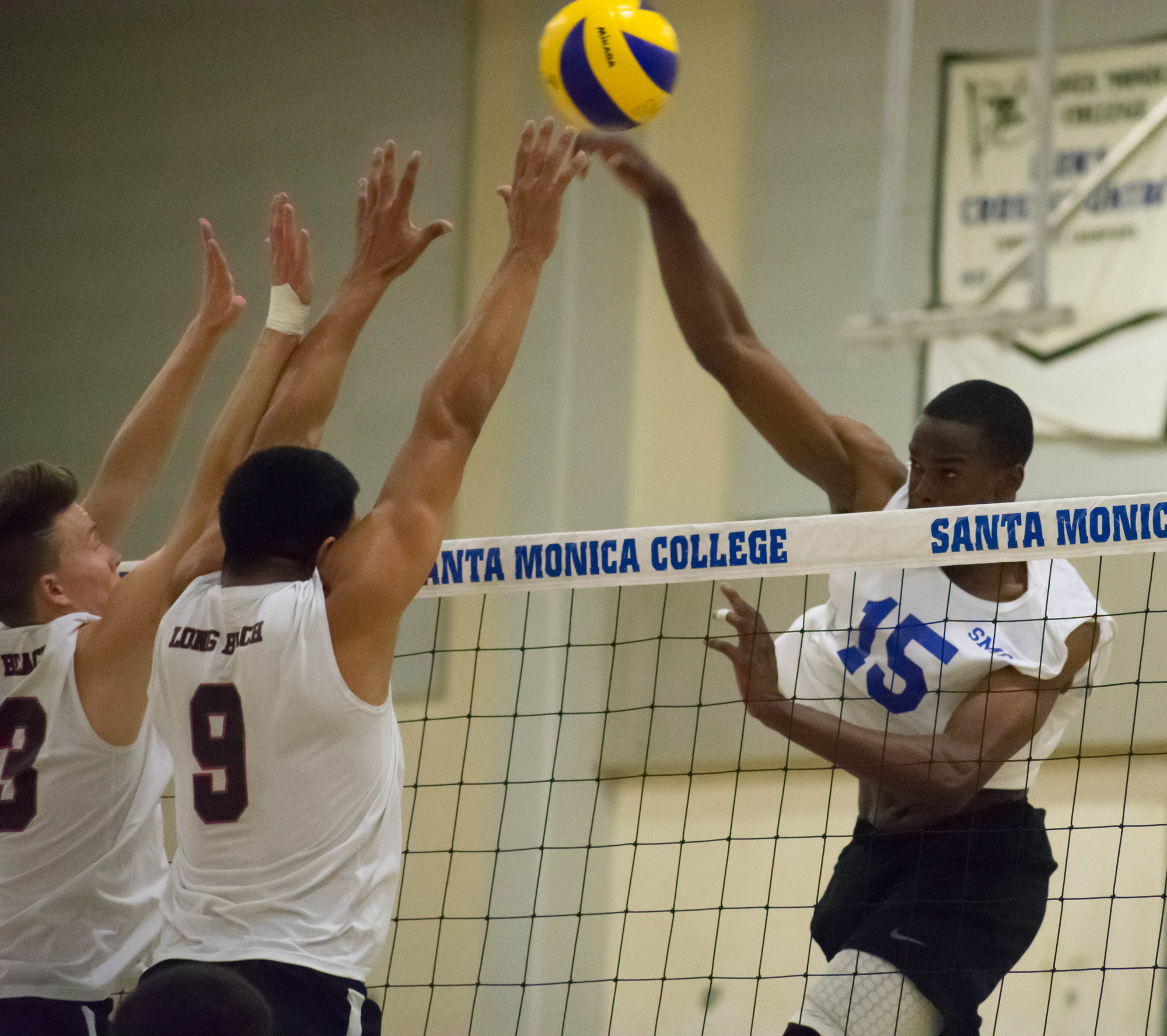  Santa Monica Corsairs sophomore and middle hitter Vecas Lewin (#15) prepares to spike the ball against the Long Beach City College Vikings during their final home game of the season on Wednesday, April 12, 2018 in the Santa Monica College gym at San