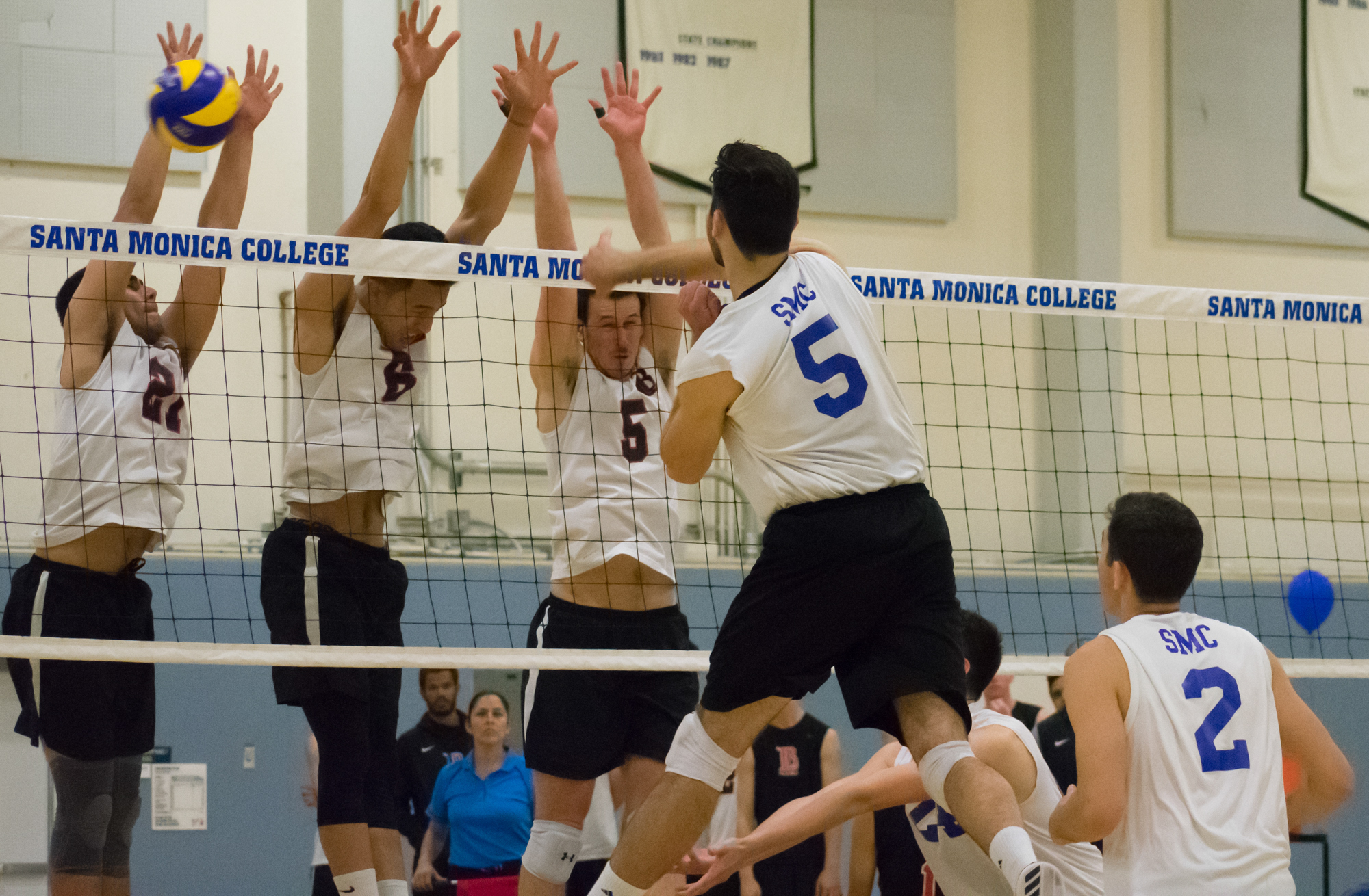  Santa Monica Corsairs sophomore and right-side hitter Andrew Dalmada (#5) spikes the ball against the Long Beach City College Vikings during their final home game of the season on Wednesday, April 12, 2018 in the Santa Monica College gym at Santa Mo