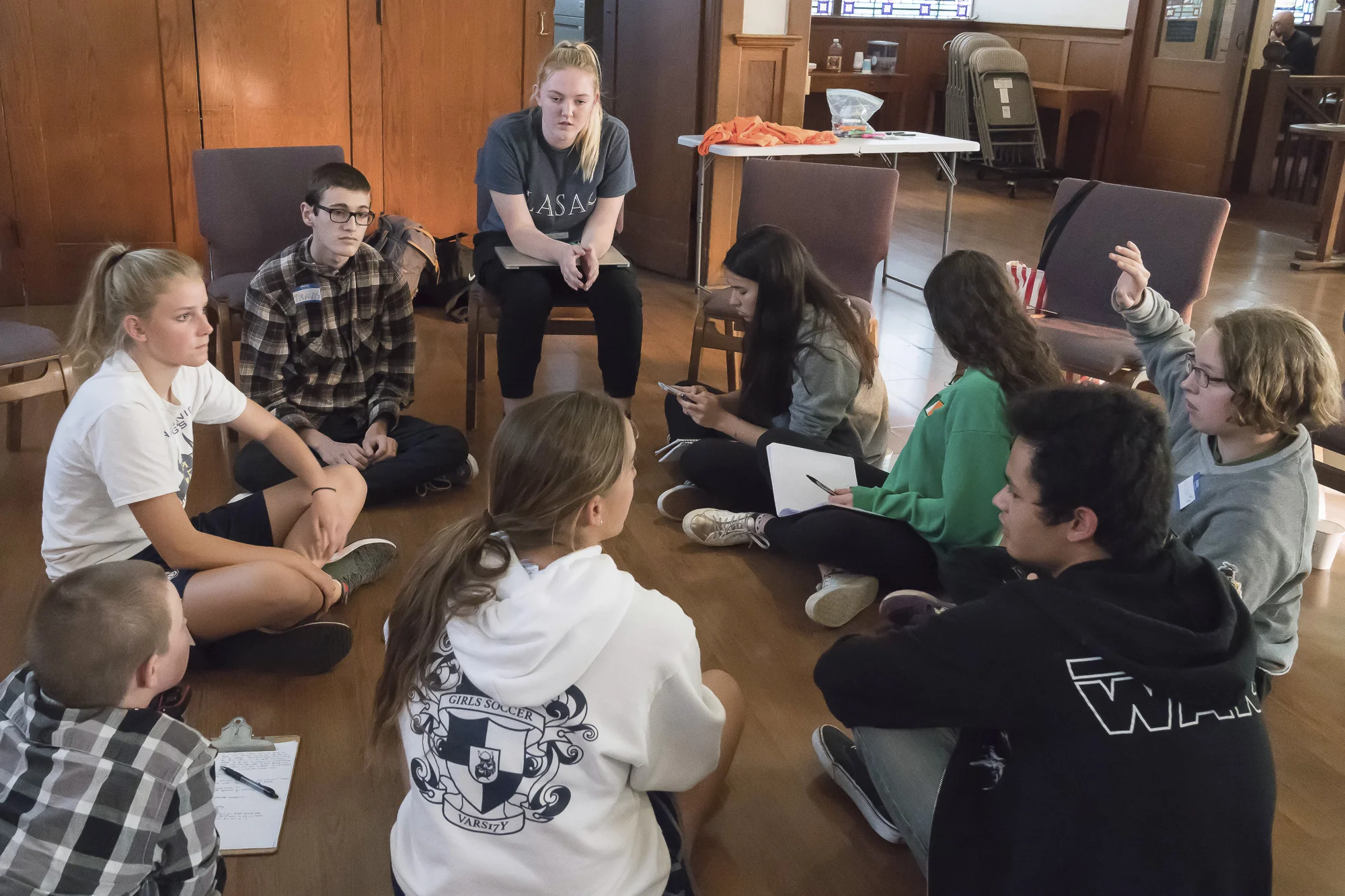 Students from several Los Angeles area high schools met in Santa Monica, California on Tuesday, April 17, 2018 to discuss a planned walkout and protest rally at Santa Monica City Hall on Friday, April 20. Clockwise from top center: Camille Hannant, Maddie Fenster, Aislinn Russell, Spencer Newman, Lorenzo De Los Reyes, Lea Yamashiro, Roger Gawne, Siri Storstein, and Travis Ackermann. (Helena Sung/Corsair Staff)