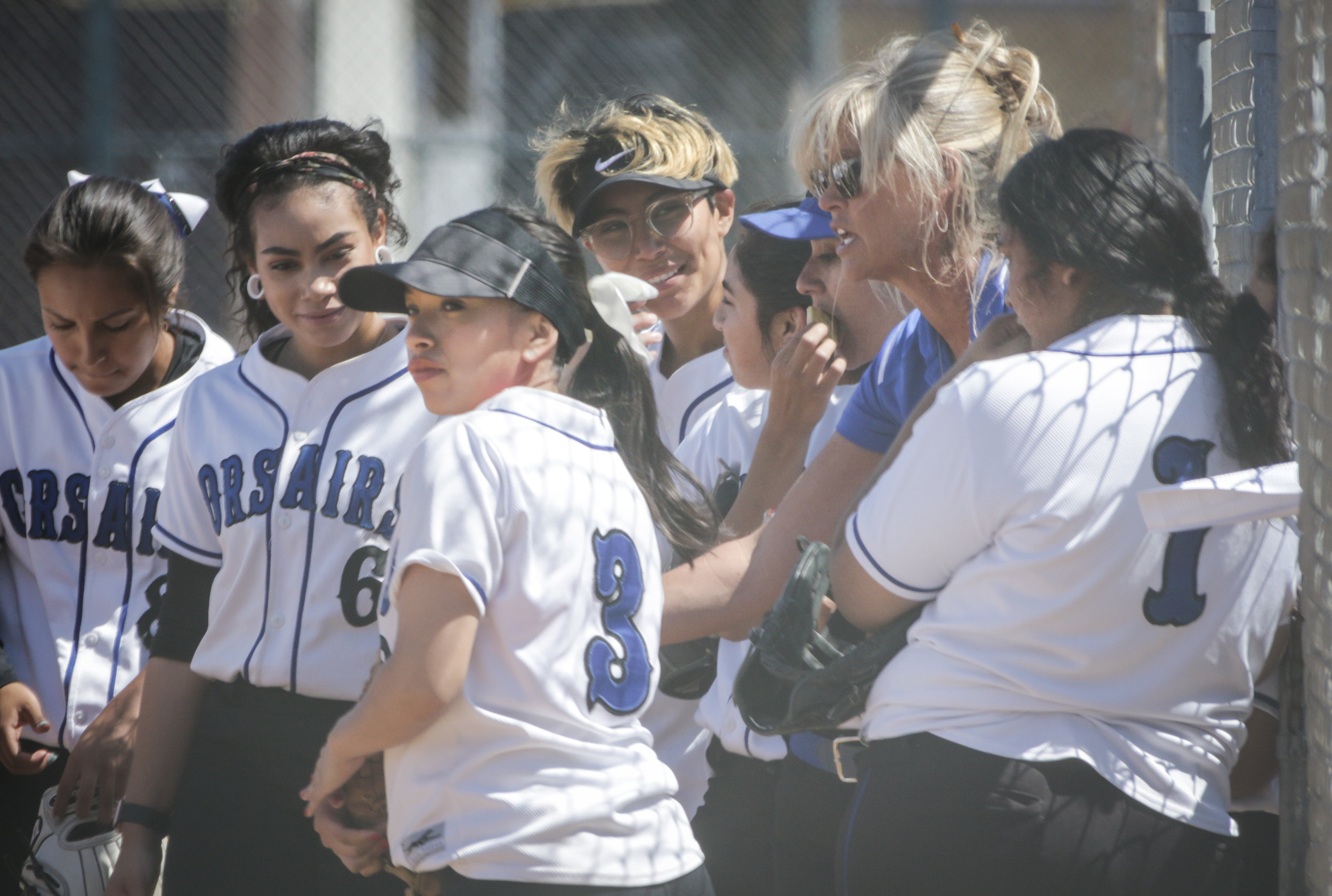  The Santa Monica College Corsair softball team huddle up with coach Chris Druckman beofre the start of the game against Oxnard College on thursday, April 19th, 2018. The game ended 3-2 in favor for Santa Monica College. (Santa Monica, California, Th