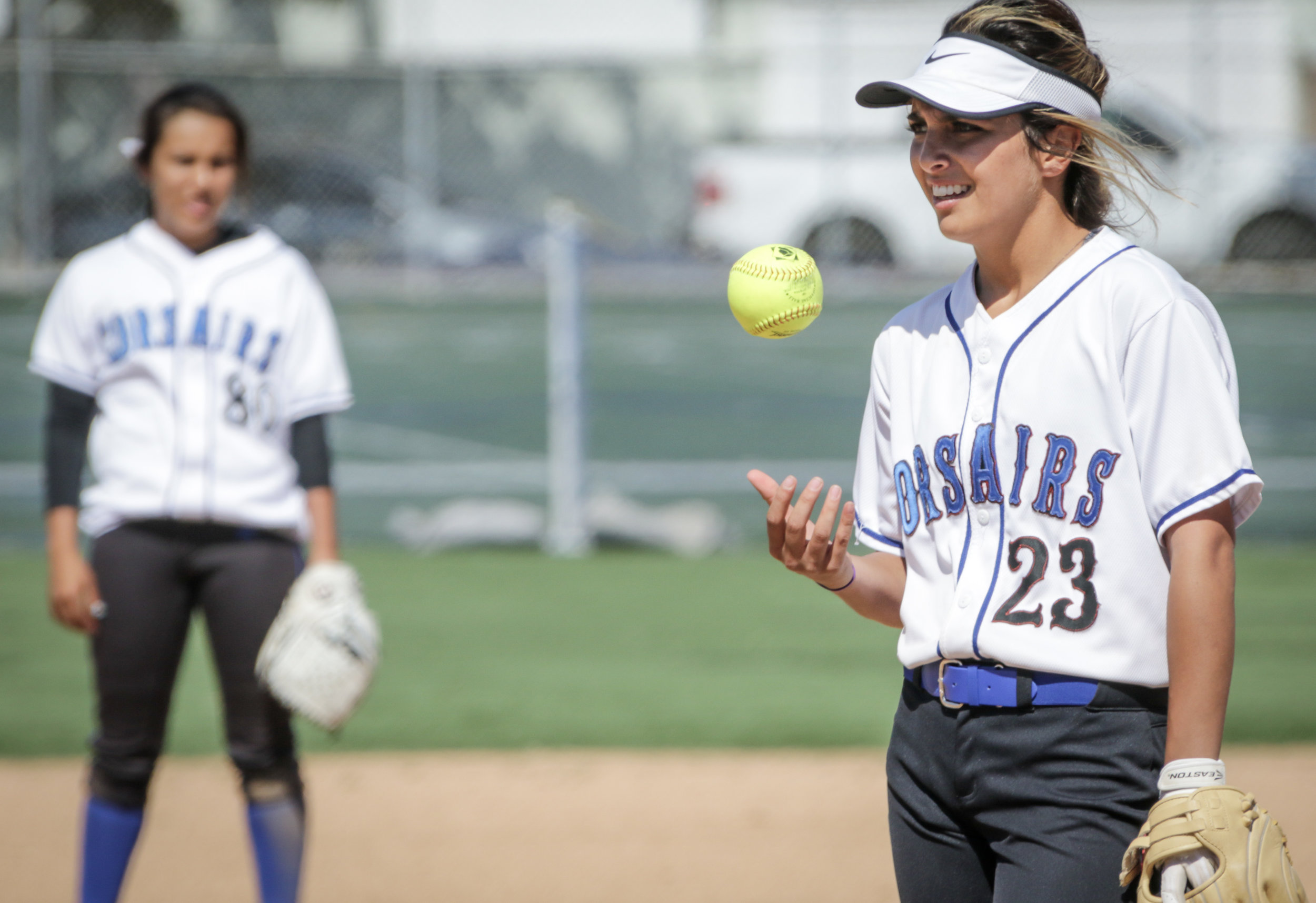  Santa Monica College Corsair softball team pitcher Taylor Liebesman taking a moment to throw her pitch as her teammate looks on during their game against Oxnard  College on thursday, April 19th, 2018. The game ended 3-2 in favor for Santa Monica Col