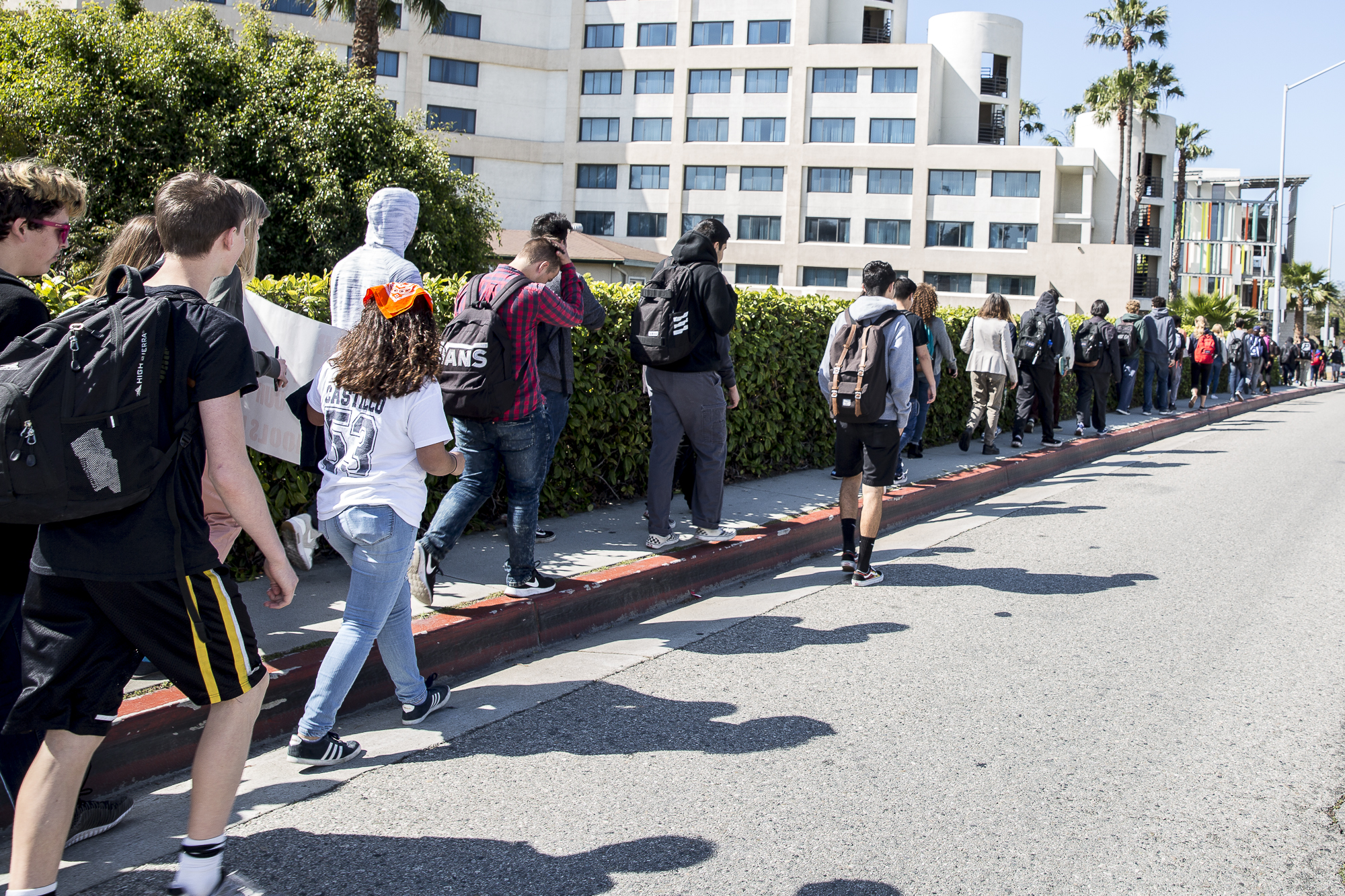 Santa Monica high school students walk down 4th street towards Santa Monica City Hall during the national student walkout that took place in Santa Monica, California on Friday, April 20 2018. Several hundred students from area high schools and middle schools converged on Santa Monica City Hall in protest against all forms of gun violence, marking also the 19th anniversary of the Columbine High School massacre. (Matthew Martin/Corsair Photo)