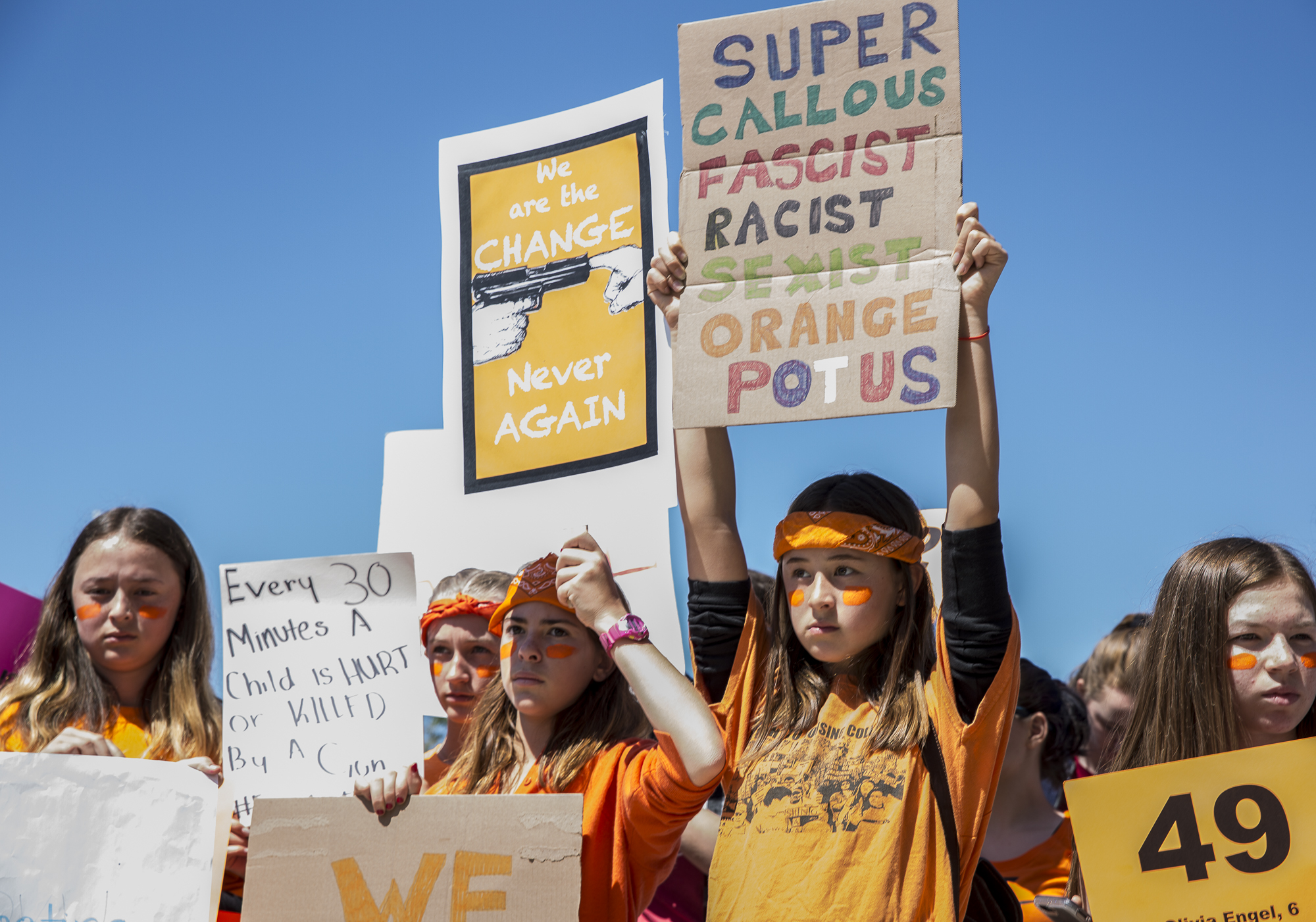  Young student activists from neighboring Santa Monica Middle Schools and High Schools hold up signs that express a desire for gun regulation while listening to key speakers during a student walkout that converged at Santa Monica City Hall in Santa M