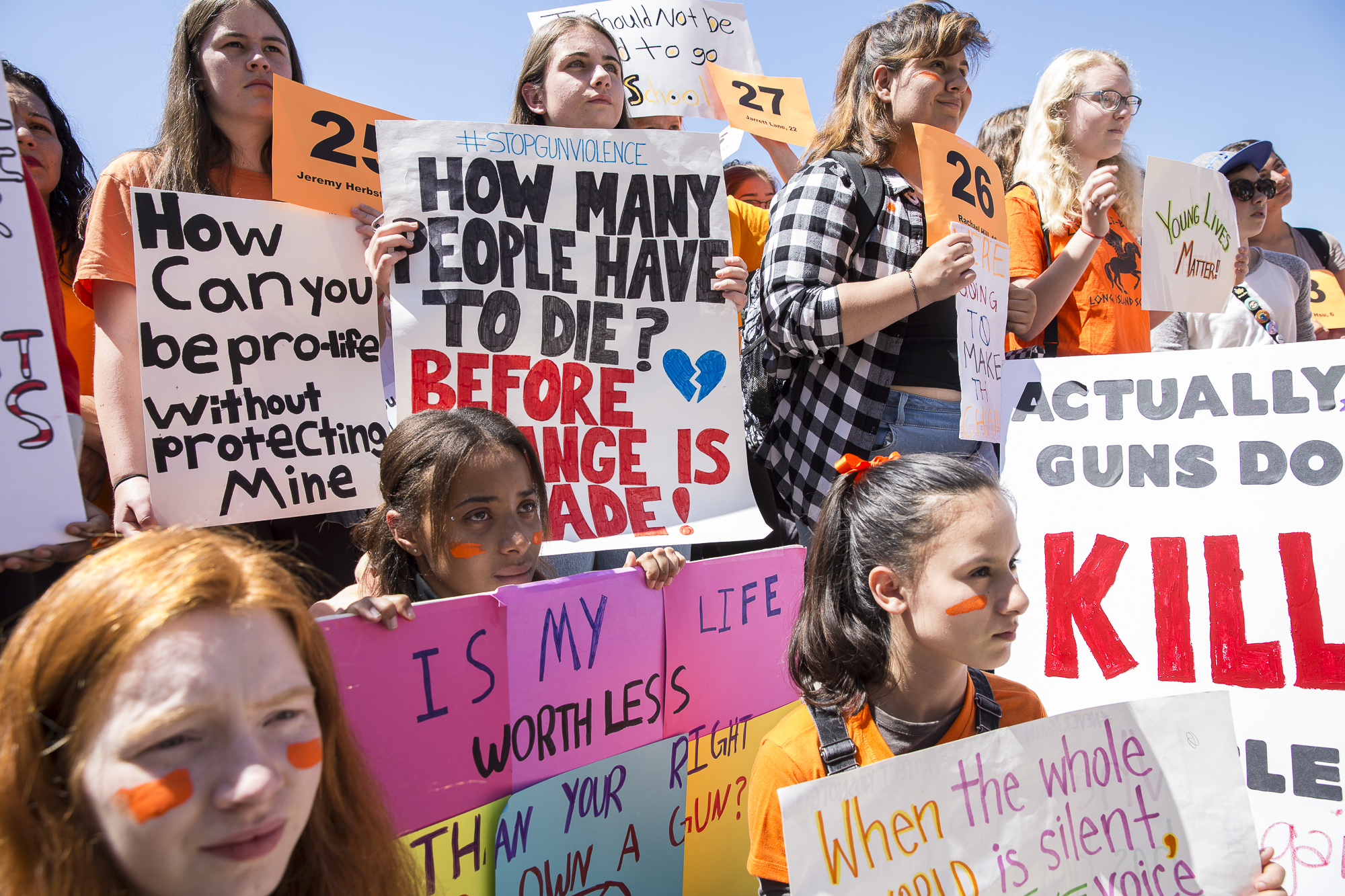 Young student activists from neighboring Santa Monica Middle Schools and High Schools hold up signs that express a desire for gun regulation while listening to key speakers during a student walkout that converged at Santa Monica City Hall in Santa Monica, California on Friday, April 20 2018. The student walkout marked the 19th anniversary of the Columbine High School massacre shooting and walkouts took place across the country so students could express their desire for a change in gun legislation. (Matthew Martin/Corsair Photo)