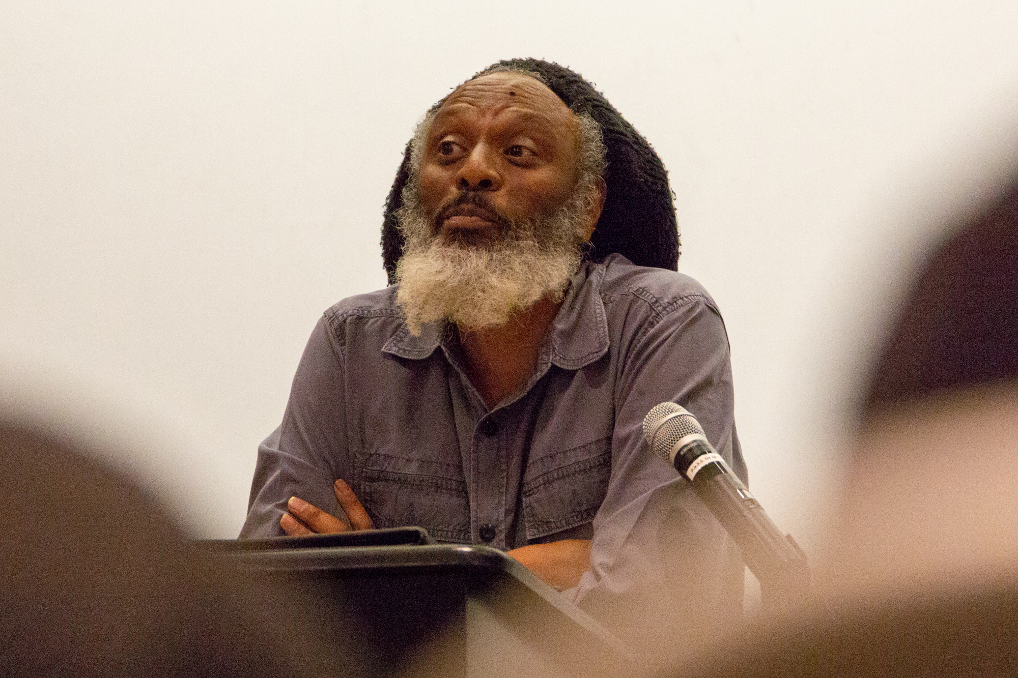  Poet and Professor of English Wilfred Doucet reads from his work at the "Modern Poetic Permutations" event held at Santa Monica College, Santa Monica, California on Thursday April 19 2018. on Thursday April 19 2018. (Ruth Iorio/ Corsair Photo) 