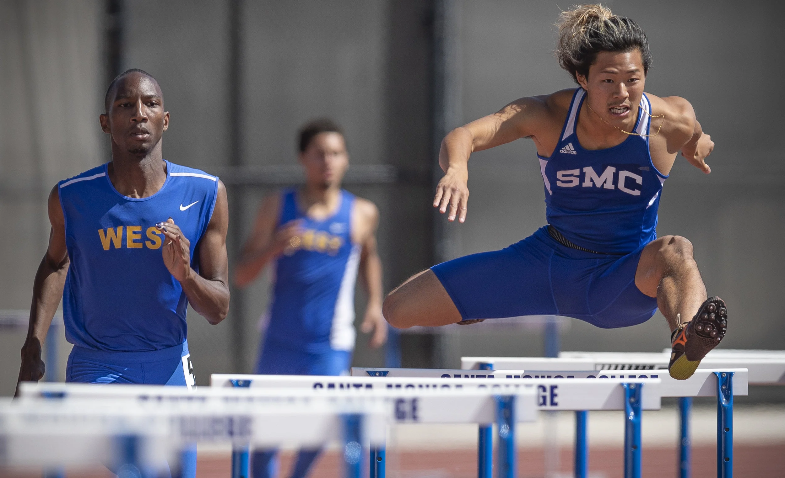 Santa Monica College 400 meter hurdle track and field athlete Gentore Sasaki (right) placed second in heat 2 of 3 during SMC's preliminaries at Santa Monica College, on friday, April 20th, 2018, in Santa Monica, Calif.. (Photo By: Daniel Bowyer / Corsair Contributor)