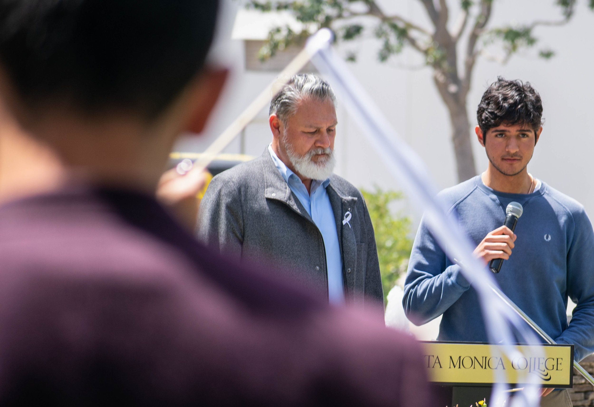  Mike Tuitasi, left, Vice President of Student Affairs at Santa Monica College led a pledge for men on campus such as Orlando Gonzalez, right, to not stay silent about violence towards women students for an event regarding sexual awareness at Santa M