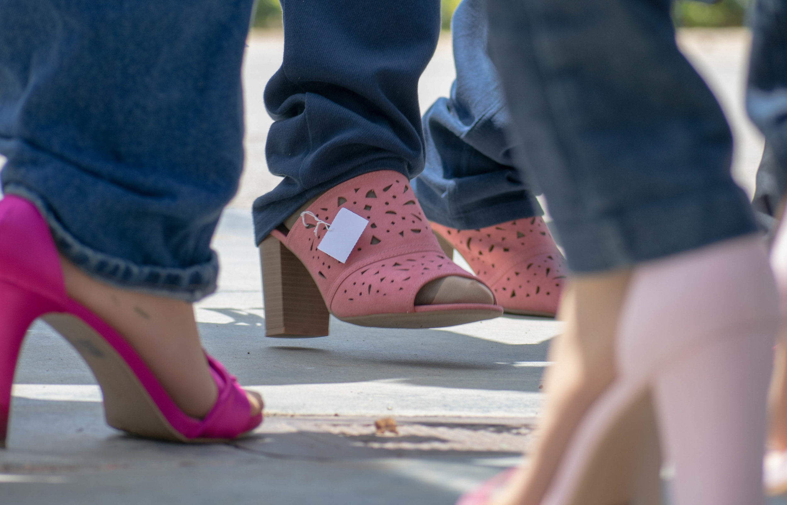  Men put on high heels during an event to show solidarity with women at Santa Monica College on Tuesday, April 24 in Santa Monica, California. The day was aimed towards men, who were encouraged to take a pledge about speaking up to sexual abuse and l