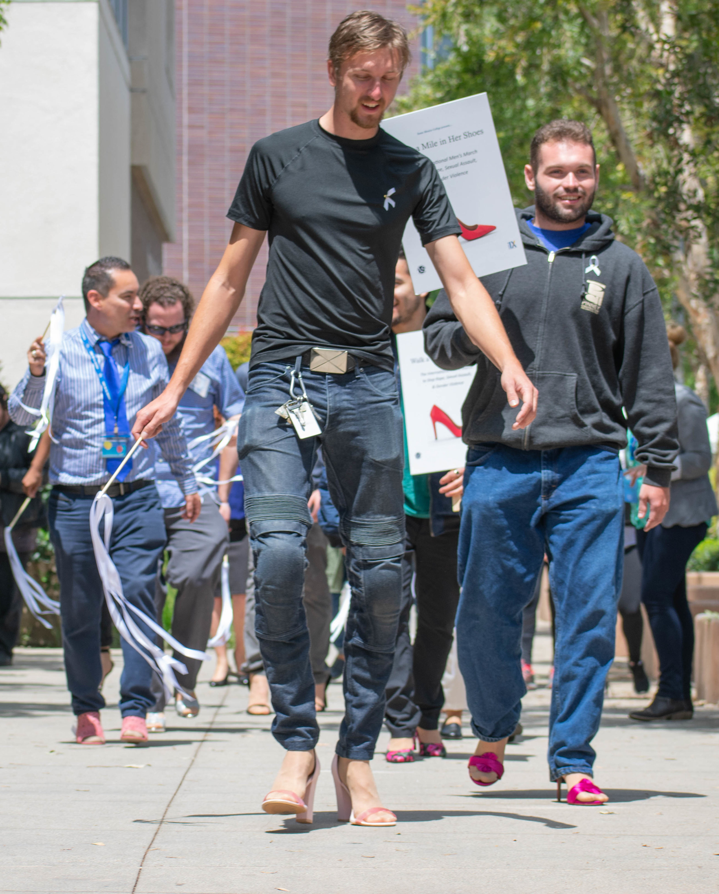  Tanner Jordan walks in front during a march for an event to show solidarity to women at Santa Monica College on Tuesday, April 24 in Santa Monica, California. The day was aimed towards men, who were encouraged to take a pledge about speaking up to s