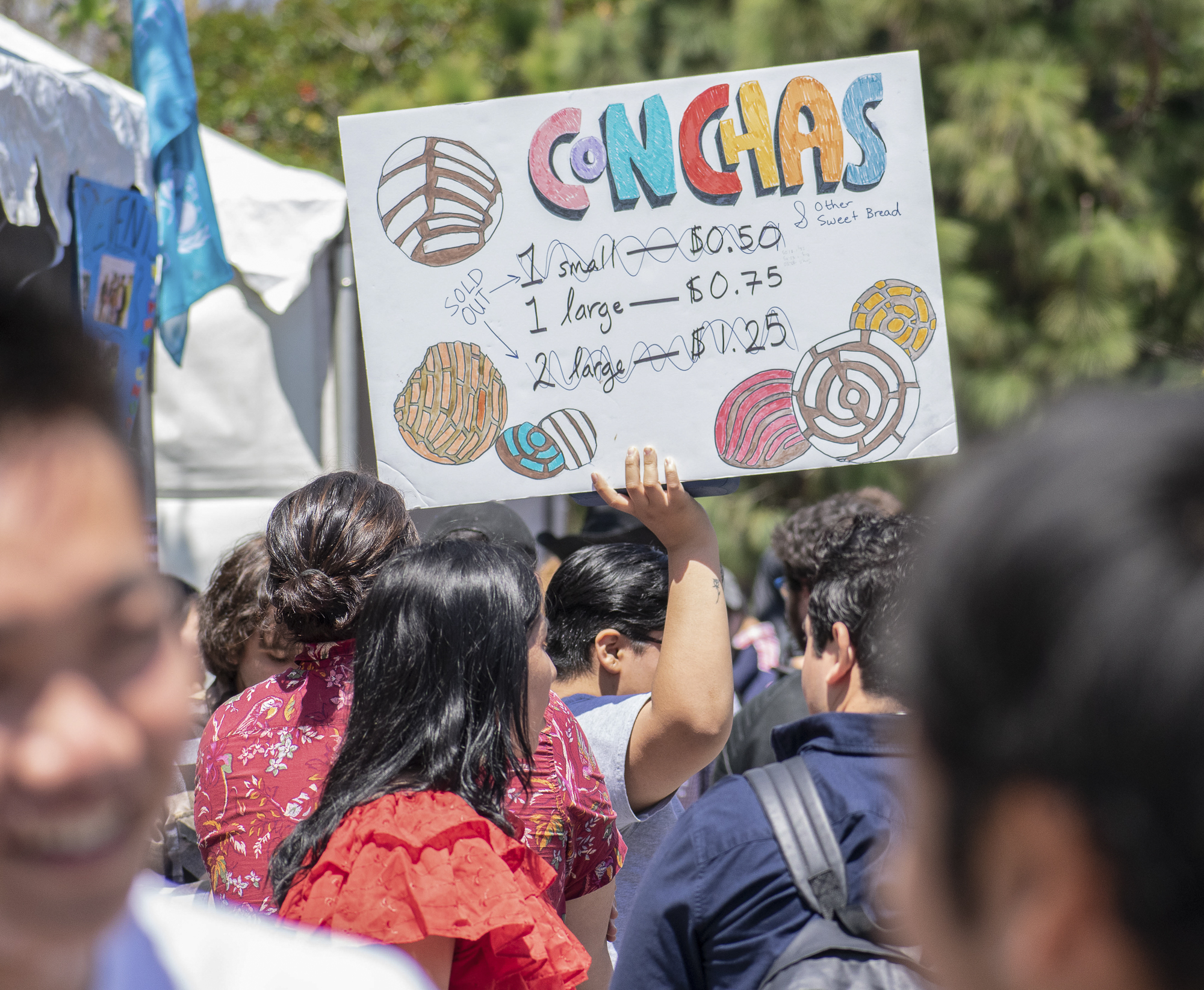 On the quad at Santa Monica College, the Adelante Club advertises the sale of conchas during Club Row on Thursday, April 26, 2018 in Santa Monica, California. With over 60 clubs in attendance, the day is meant to encourage clubs to showcase what they’ve been doing over the semester for students. (Ethan Lauren/Corsair Photo)