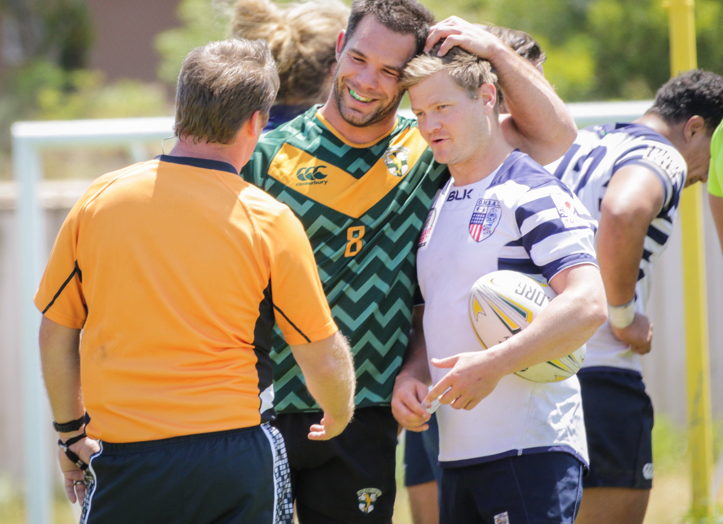  Santa Monica Rugby player Shane Spring (#8, Middle) with Old Mission Beach Athletic Club player talking to the referee during their game held at Westchester High School on Saturday, April 28th, 2018. The game ended 26-7 in favor for OMBAC. (Westches