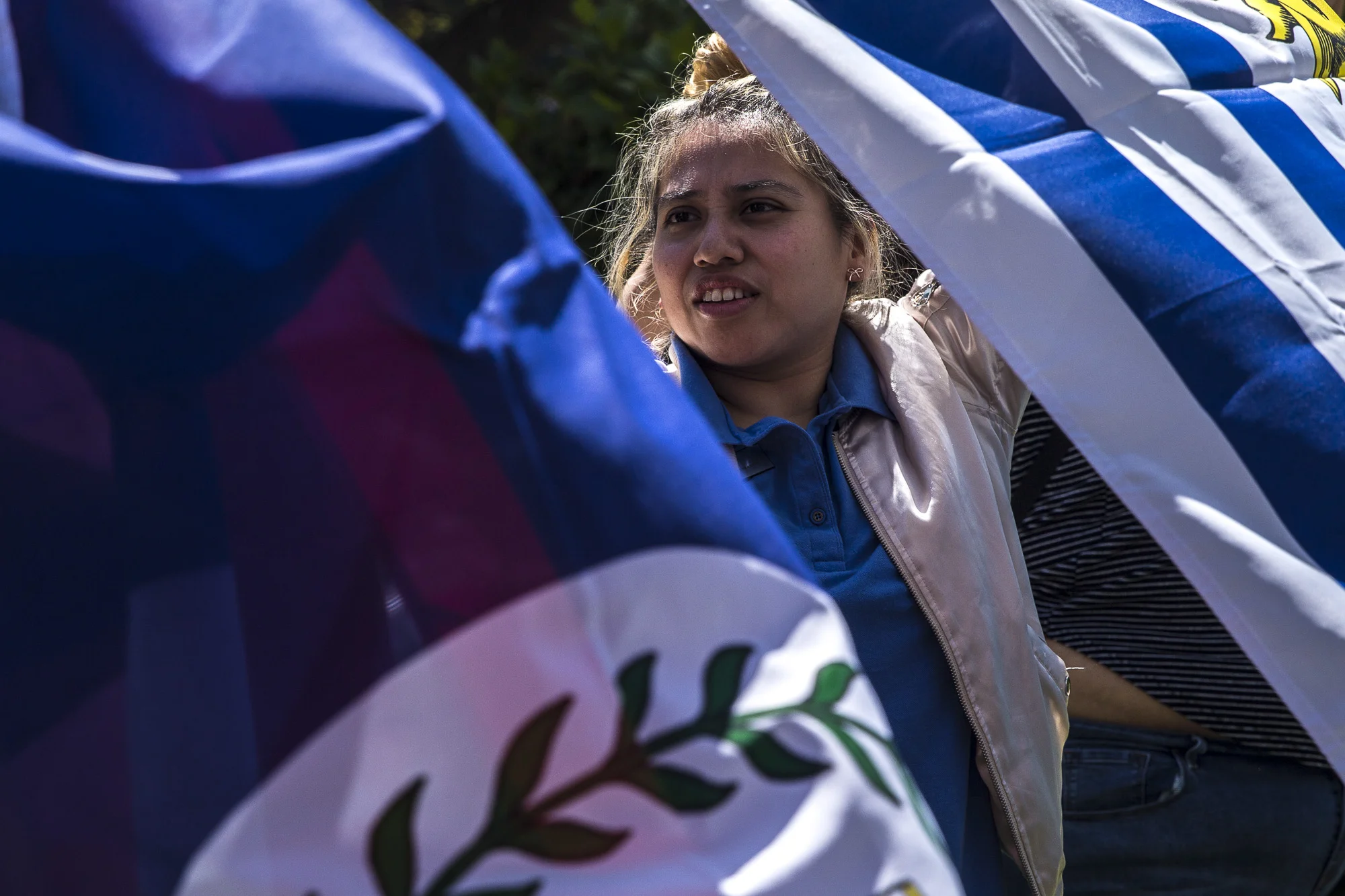  Santa Monica College students and “Adelante” club members help set up flags and decorations for the Cinco de Mayo Celebratory event that took place in front of the clock tower on the SMC main campus on Thursday, May 3 2018.  This event was put toget