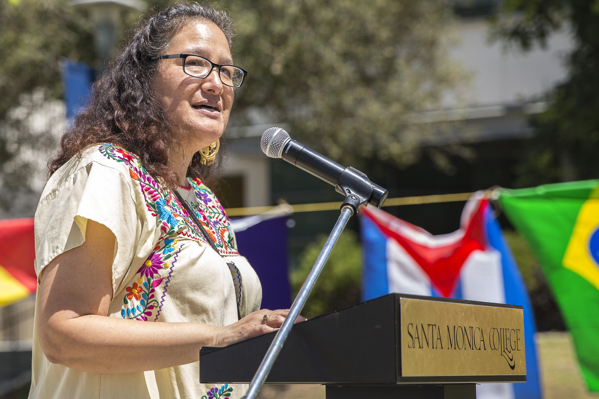  Santa Monica College (SMC) “Adelante” club advisor and Cinco de Mayo celebration event organizer Maria Martinez speaks to the students and faculty in attendance before the Cinco De Mayo celebration festivities begins in front of the clock tower on t