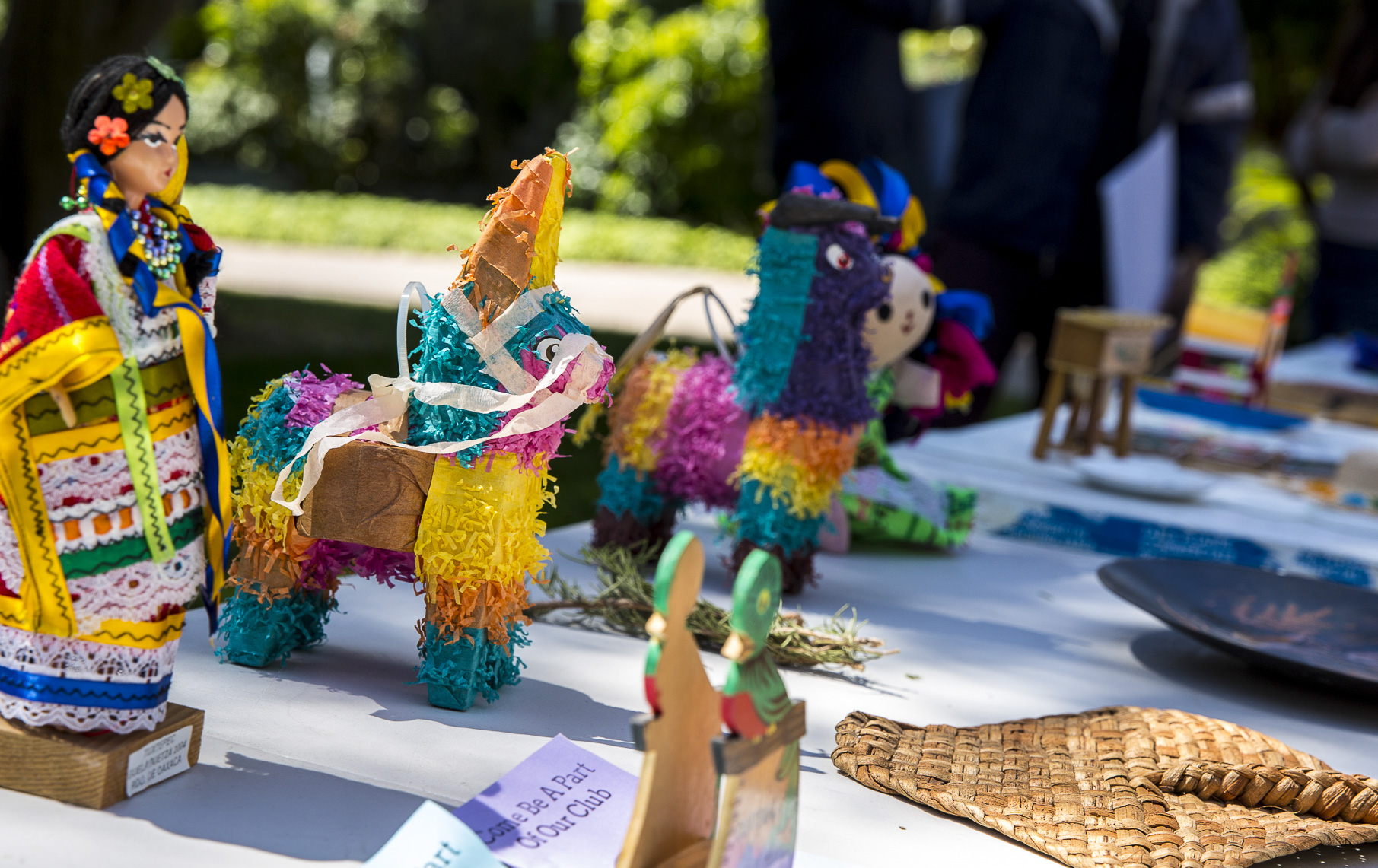  A shot of a table with paraphernalia consisting of items that represent Cinco De Mayo and pamphlets asking students to join the Santa Monica College club that hosted the event, “Adelante”, in front of the Santa Monica College (SMC) Clock Tower on th