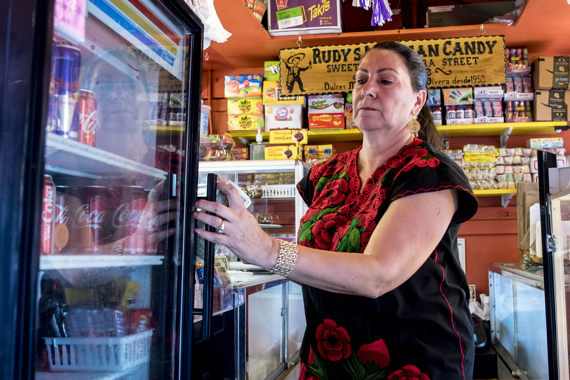  Berta Gomez helps a customer at her refreshment shop on Olvera Street during the Cinco De Mayo celebrataions. Gomez stated that Olvera Street used to have a week long celebration of Cinco De Mayo which brought in many tourists and school trips. The 