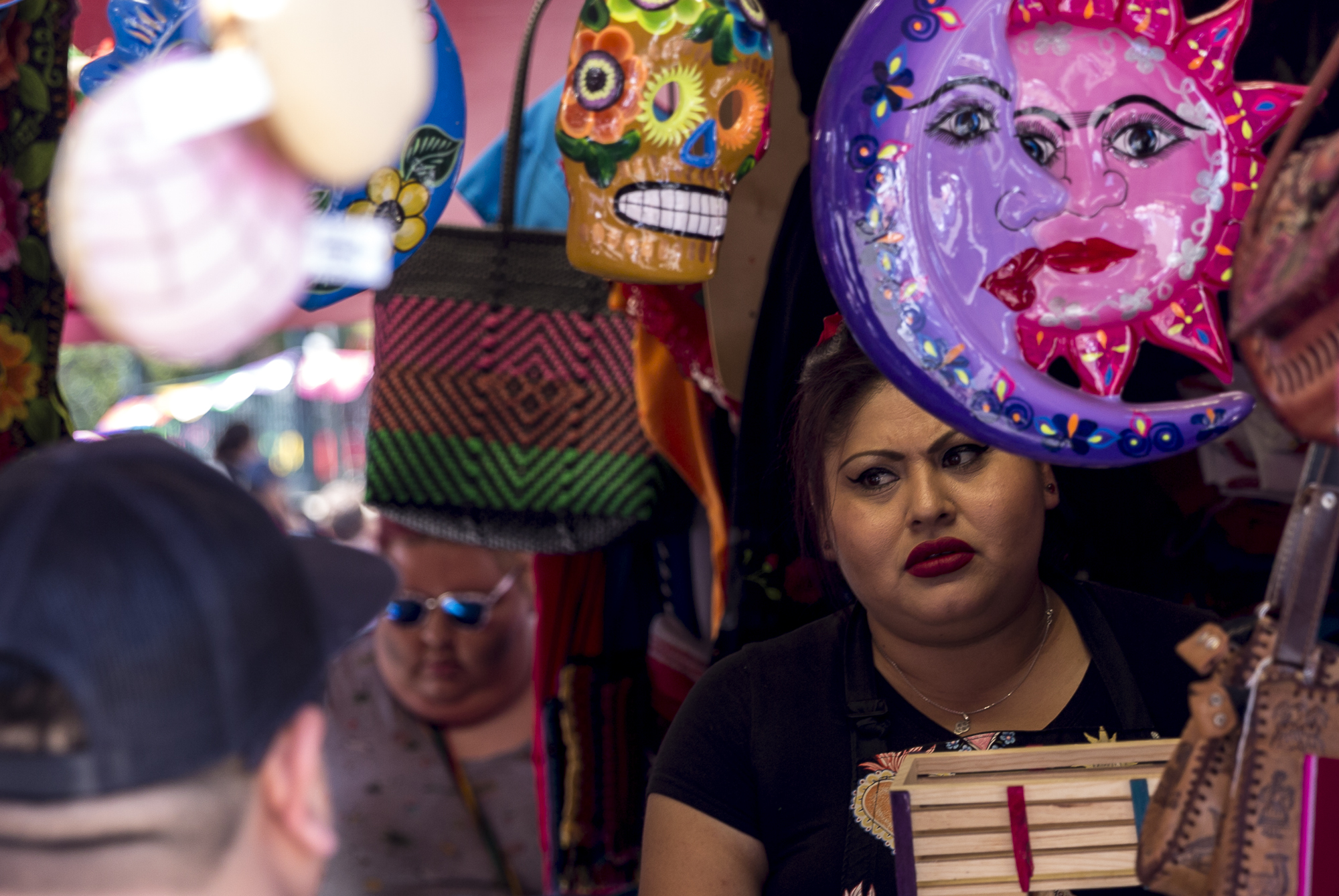  A stall owner has an argument with a customer over costs of one of her products being sold during the annual Olvera Street Cinco De Mayo celebration in Downtown Los Angeles, California on May 5, 2018. (Matthew Martin/Corsair Photo) 