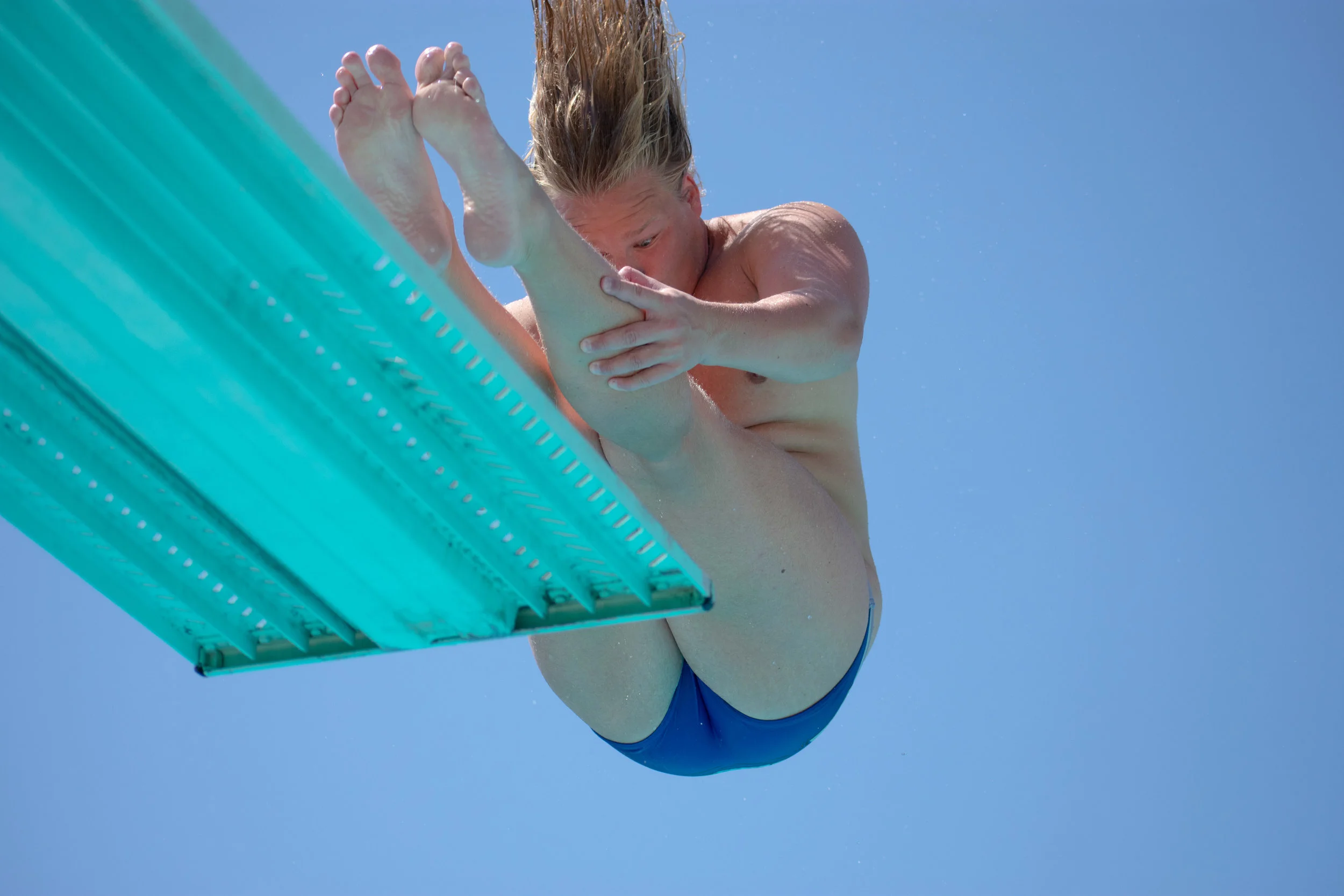 Henri Helin dives from the three-meter board during practice on Thursday, April 26, 2018 at the Santa Monica Swim Center in Santa Monica, California. Helin will be headed to the CCCAA Swim and Dive State Championships, which will be held from Monday, May 3 to Saturday, May 6 to dive from the one and three-meter board. (Ethan Lauren/Corsair Photo)
