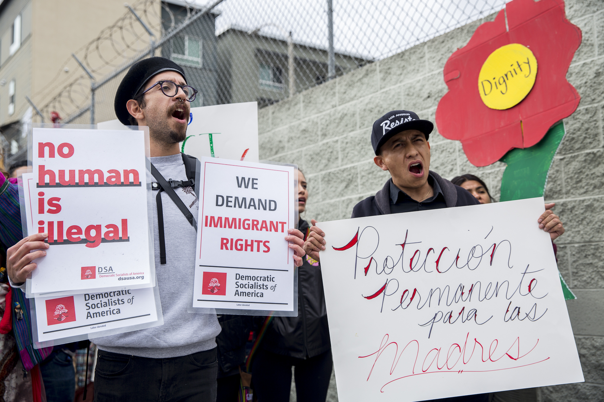  Movimiento Cosecha members Joseph Nicks (left) and Ricardo Rodriguez (right) march down 7th street from MacArther Park chanting and holding signs regarding the mistreatment of immigrants in the United States during the undocumented immigrant mother’