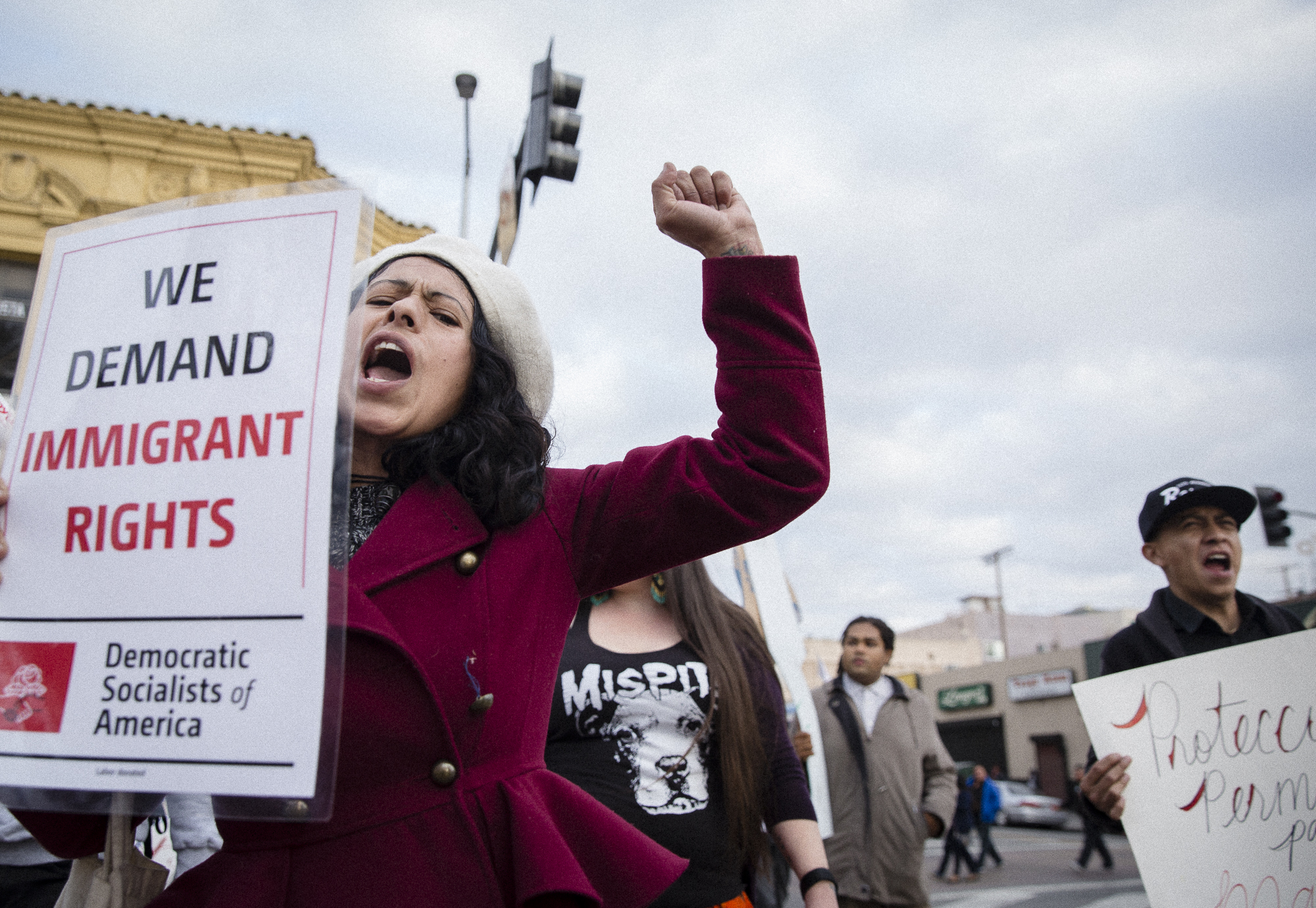  Alejandra Martinez, a Guatemalan immigrant who migrated to the United States in the mid 1980’s with her family during the Guatemalan civil war and who recently became a U.S. citizen after marrying her partner, marches down Alvarado St. during the un