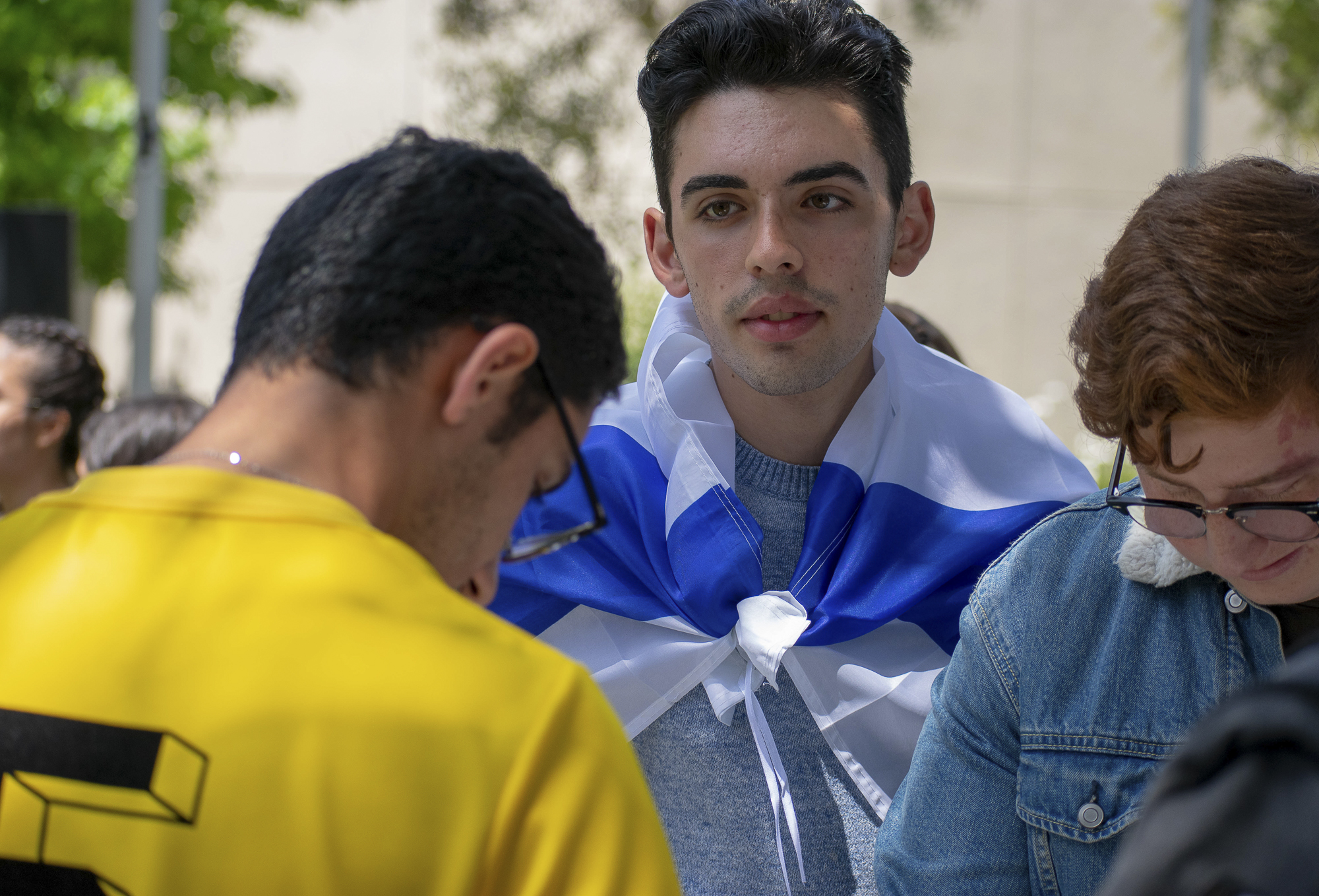  Itzchak “Isaac” Maghen plays backgammon while wearing the flag of Israel on his back during an event put on by the Students Supporting Israel club at Santa Monica College on Thursday, May 10 in Santa Monica, California. The event was a celebration f