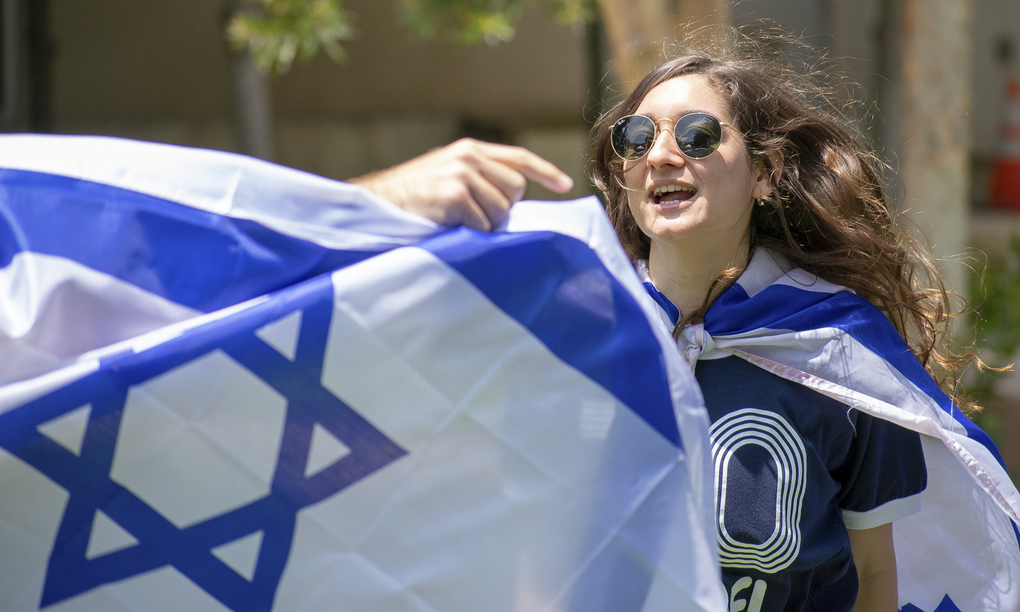  Shir Atias, an international student From Israel dances to Israeli music during an event put on by the Students Supporting Israel club at the college on Thursday, May 10 in Santa Monica, California. The event was a celebration for the 70th anniversa