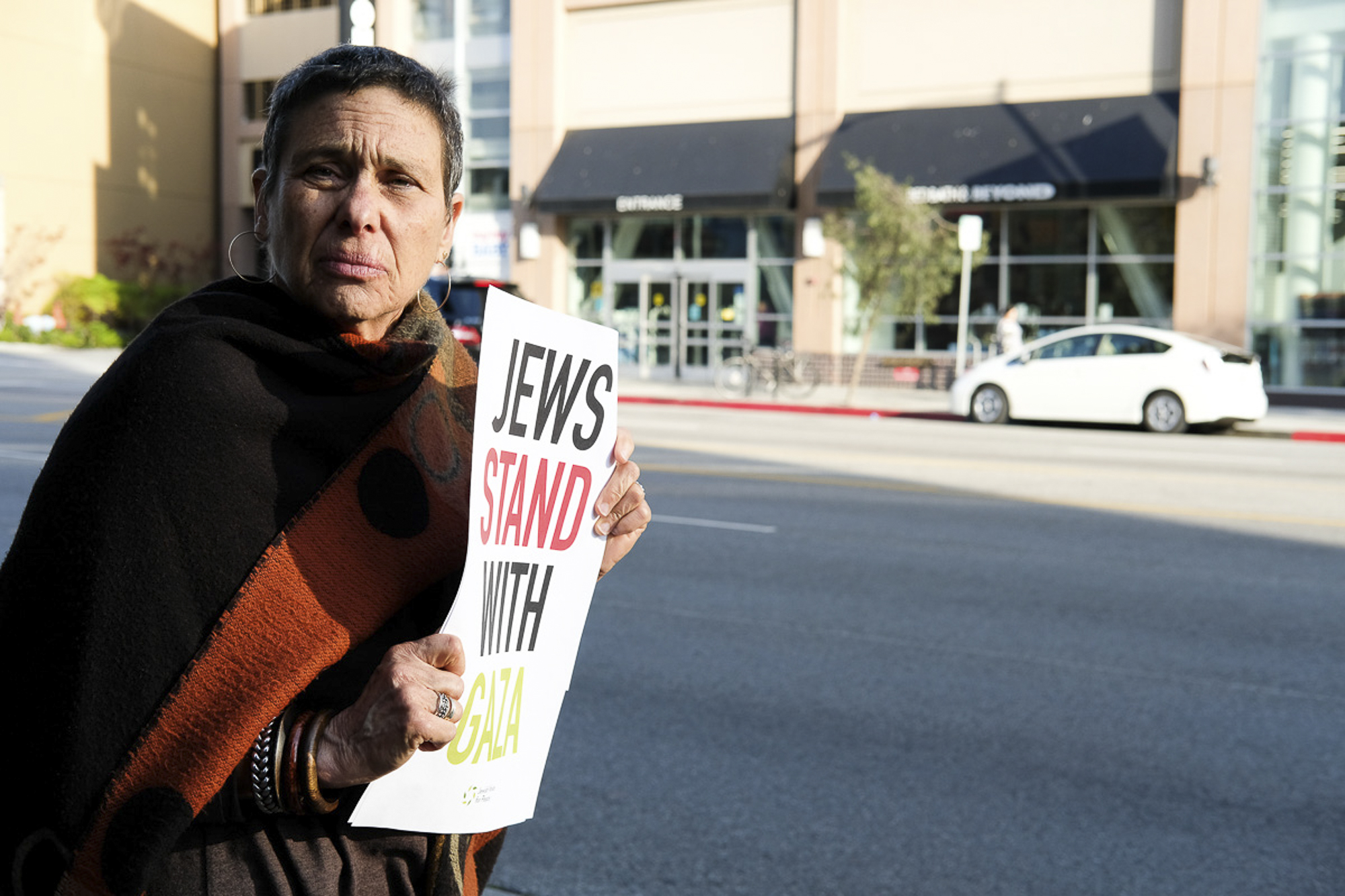  Standing on Olympic Blvd holding a sign that states "Jews Stand with Gaza" in Santa Monica, California on May 18, 2018. (Jayrol San Jose/Corsair Contributor) 