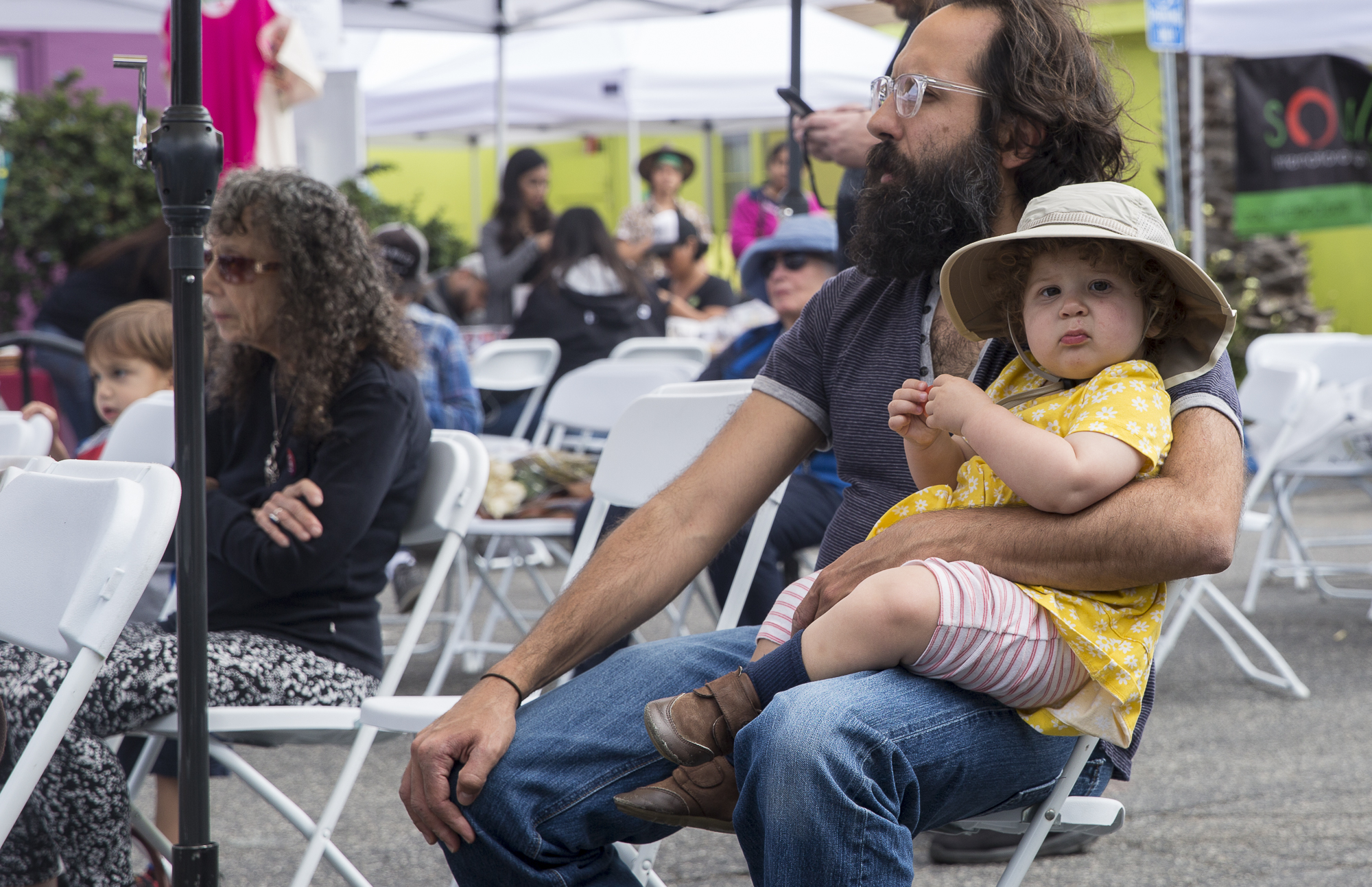 A family watches the various cultural and youth based performances during the Pico Block Party festivities that took place at the 18th street Arts Center in Santa Monica, California on Saturday May 19, 2018. The Pico Block Party is a celebration of 