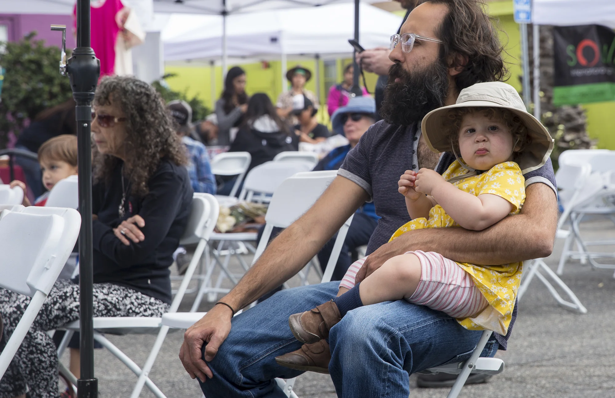 A family watches the various cultural and youth based performances during the Pico Block Party festivities that took place at the 18th street Arts Center in Santa Monica, California on Saturday May 19, 2018. The Pico Block Party is a celebration of artists and cultures of the Pico neighborhood in Santa Monica with the festivities primarily focusing on youth artists and empowering youth voices. (Matthew Martin/Corsair Photo)