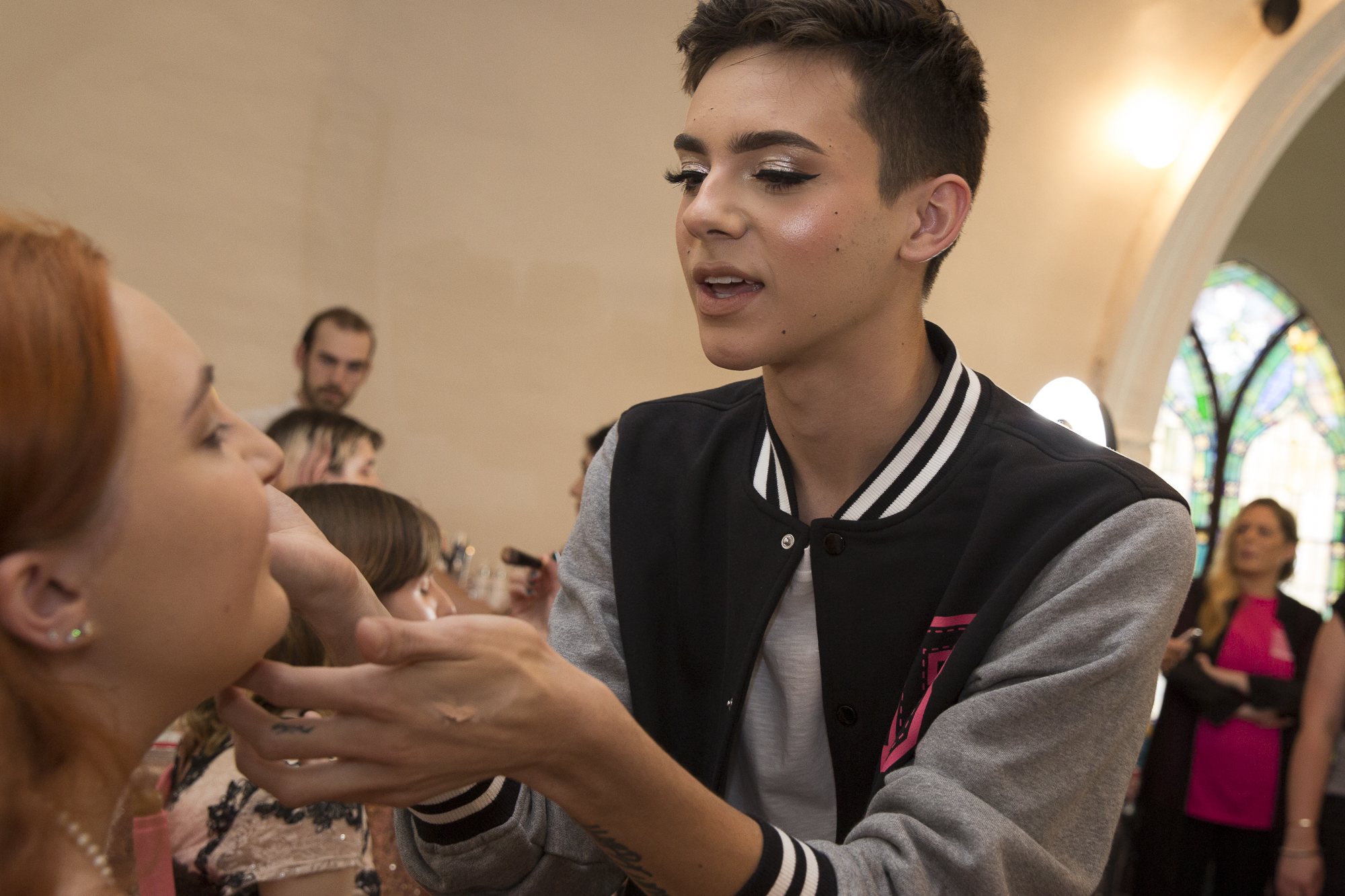 Kate Babbe (left) gets her makeup done by Instagram influencer Ryan B. Potter (right) at the annual Westside LGBTQ+ Prom at the interfaith Church in Ocean Park in Santa Monica California on Friday May 18, 2018. The interfaith church has held “Queer Proms” in the past, but this year was the first that the prom’s sponsor, Young People Creating Change (YPCC), partnered with the Princess Project Los Angeles (PPLA), Benefit Cosmetics, and Teen Vogue to produce the event. (Matthew Martin/Corsair Photo)