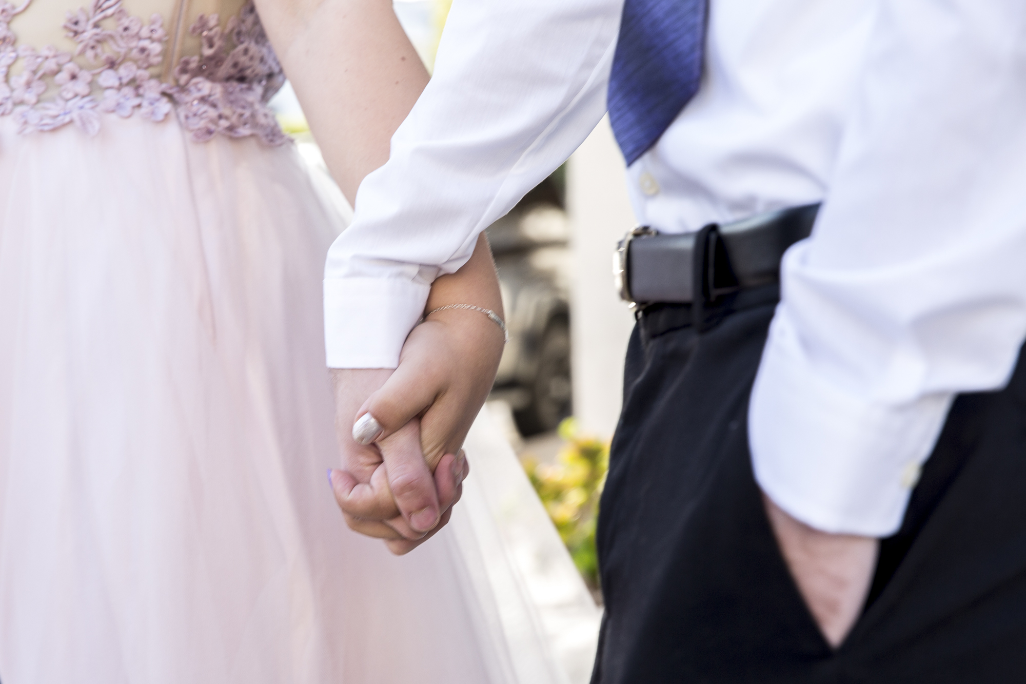Couple Amy Woodfine (left) and Tony Hokenson (right) hold hands outside the interfaith Church in Ocean Park in Santa Monica California on Friday May 18, 2018. The interfaith church has held “Queer Proms” in the past, but this year was the first that the prom’s sponsor, Young People Creating Change (YPCC), partnered with the Princess Project Los Angeles (PPLA), Benefit Cosmetics, and Teen Vogue to produce the event. (Matthew Martin/Corsair Photo)