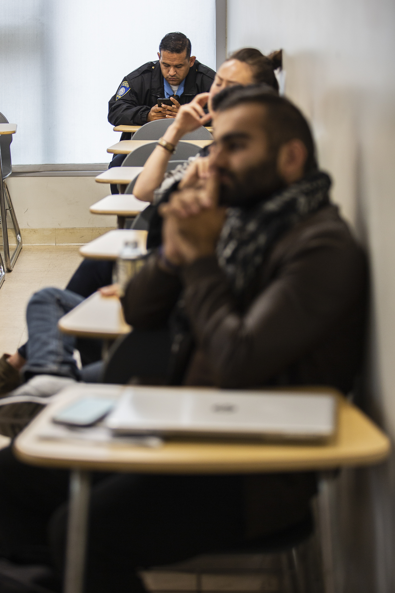  A security guard (who declined to give his name) attends the 'Answering Tough Questions about Israel' meeting held by Santa Monica College's Students Supporting Israel group at the Santa Monica College main campus in Santa Monica, California on Thur