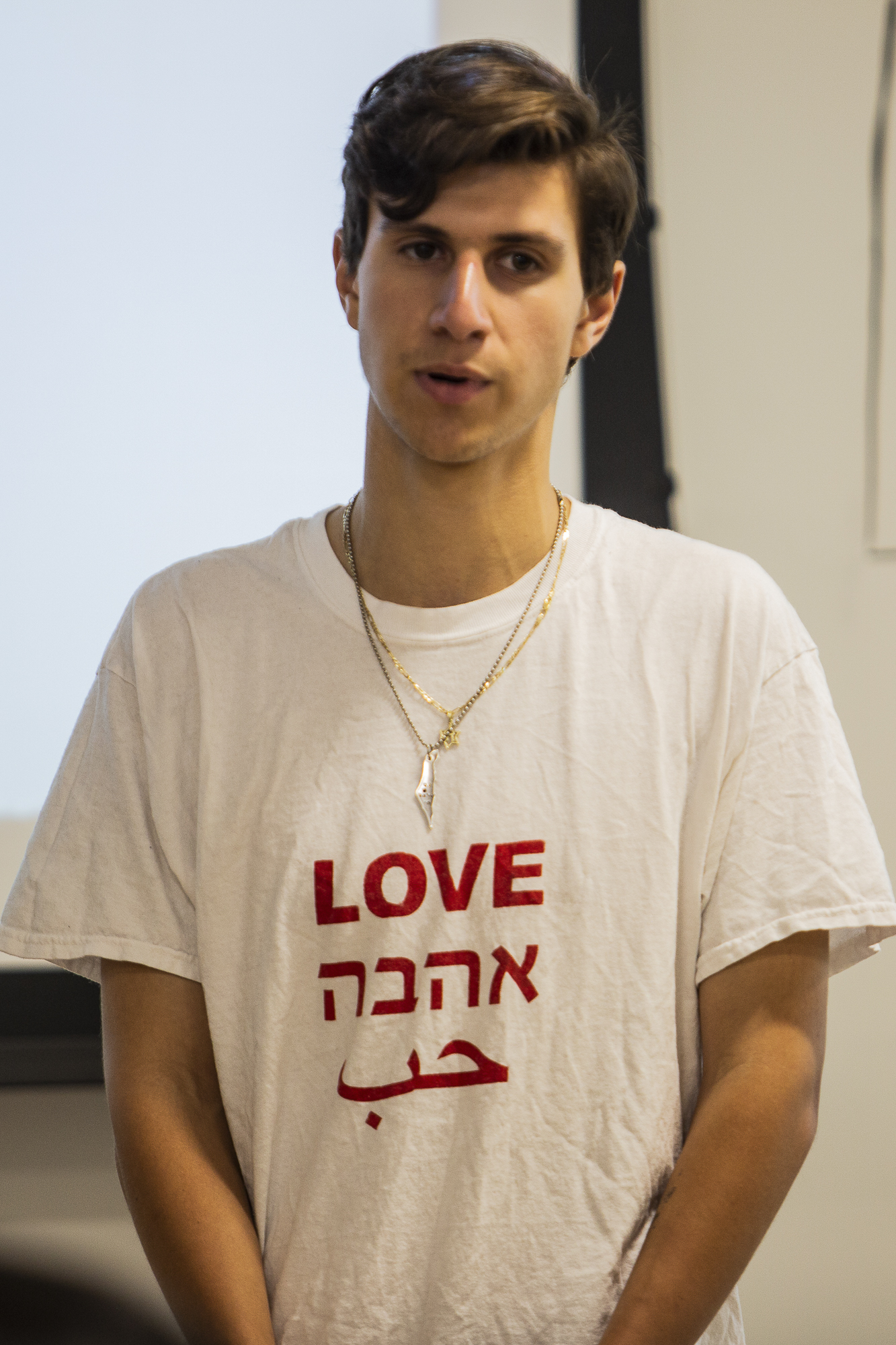 Justin Feldman, the spokesperson for Students Supporting Israel, chairs the 'Answering Tough Questions About Israel' meeting while wearing a t-shirt which declares LOVE in hebrew at the Santa Monica College main campus in Santa Monica, California on