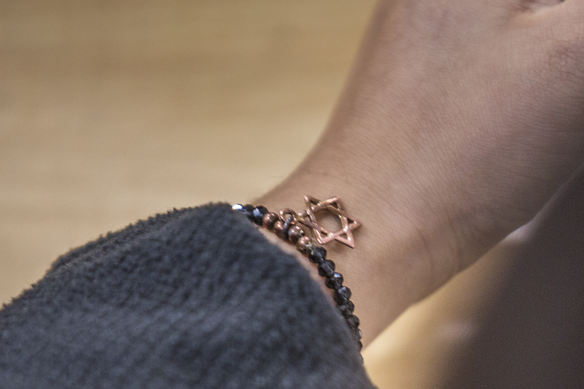 A young girl's sleeve falls back revealing the distinctive Magen David, or star of David, the symbol of Israel during the Supporting Israel event 'Answering Tough Questions About Israel' at the Santa Monica College main campus in Santa Monica California on hursday May 24 2018. The majority of the students attending the Students Supporting Israel event 'Answering Tough Questions About Israel' were Jewish with ties to Israel. (Ruth Iorio/Corsair Photo)
