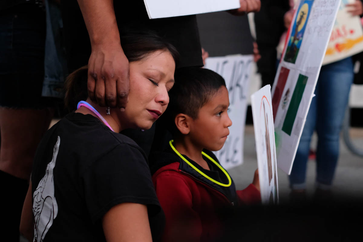 A woman gets comfort from her family during the Justice for Claudia vigil in Los Angeles, California on June 1, 2018.(Jayrol San Jose/Corsair Contributor)