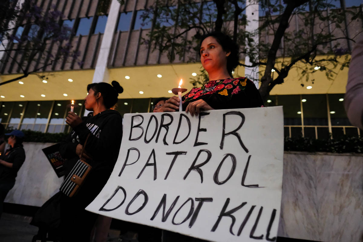  A protester stands with a candle during the Justice for Claudia Vigil in Los Angeles, California on June 1, 2018.(Jayrol San Jose/Corsair Contributor) 