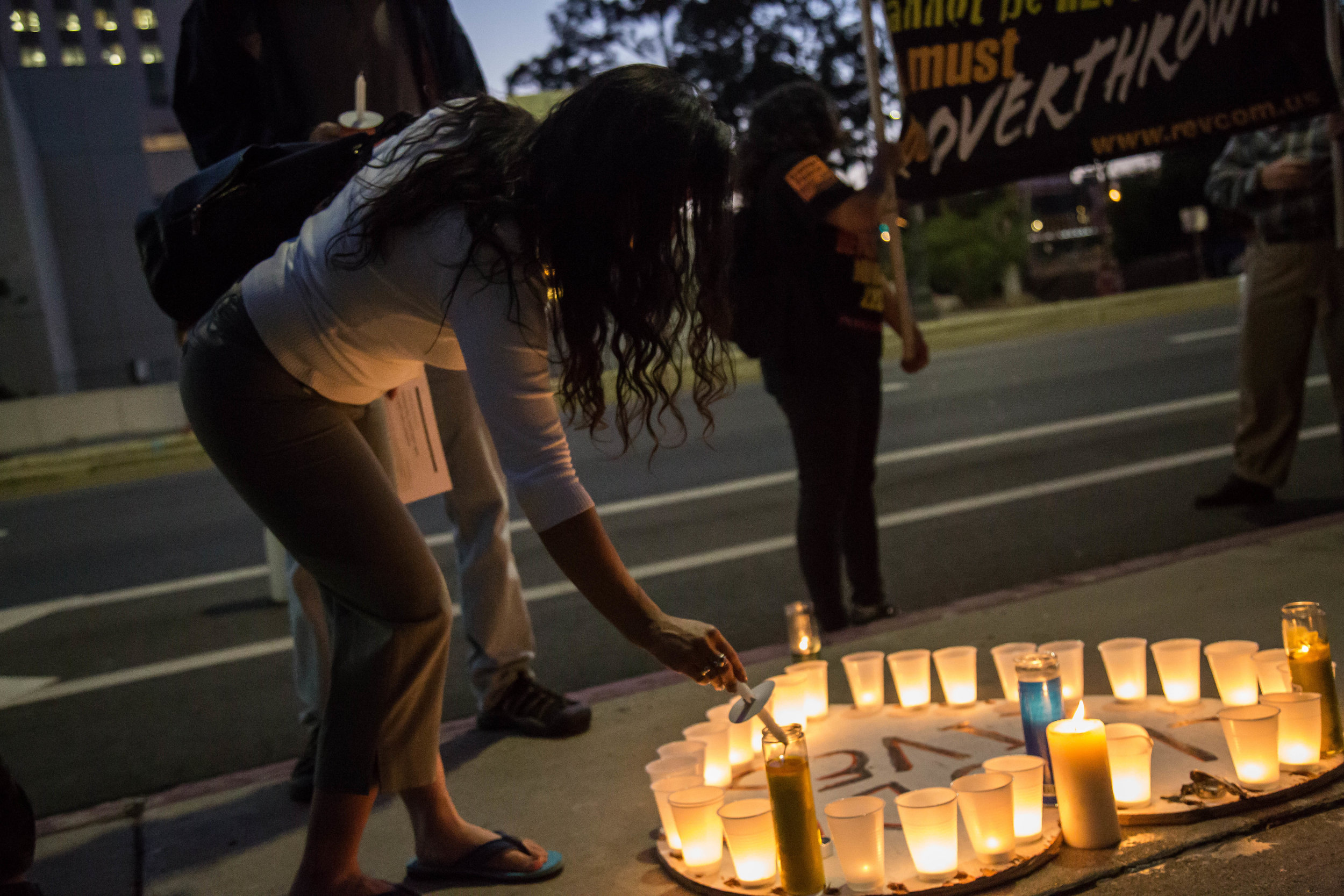  Participants of "Justice for Claudia and All kidnapped Indigenous children!" lights up their candle to demand justice for Claudia Patricia Gómez González in front of the United States Citizenship and Immigration building in Downtown Los Angeles, Cal