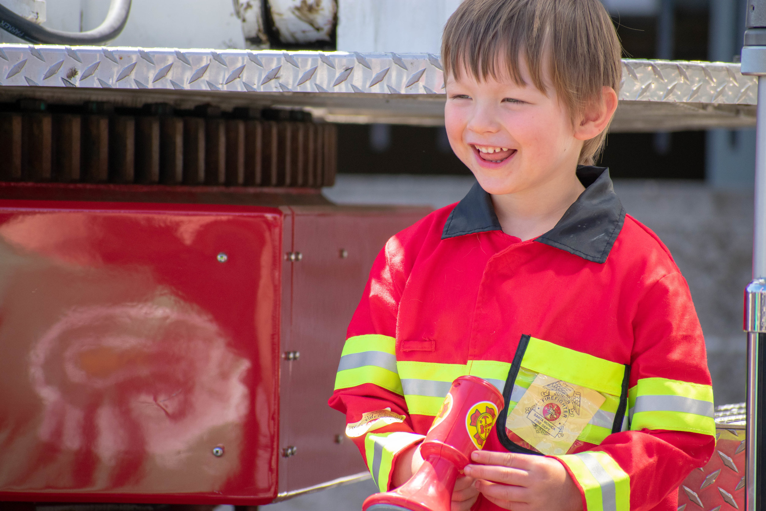  A child sits on a fire engine during a groundbreaking event in downtown Santa Monica on Saturday, June 2 at the location for the newest station. Located on 1444 7th St, the station will be replacing Fire Station No. 1, which is currently the busiest