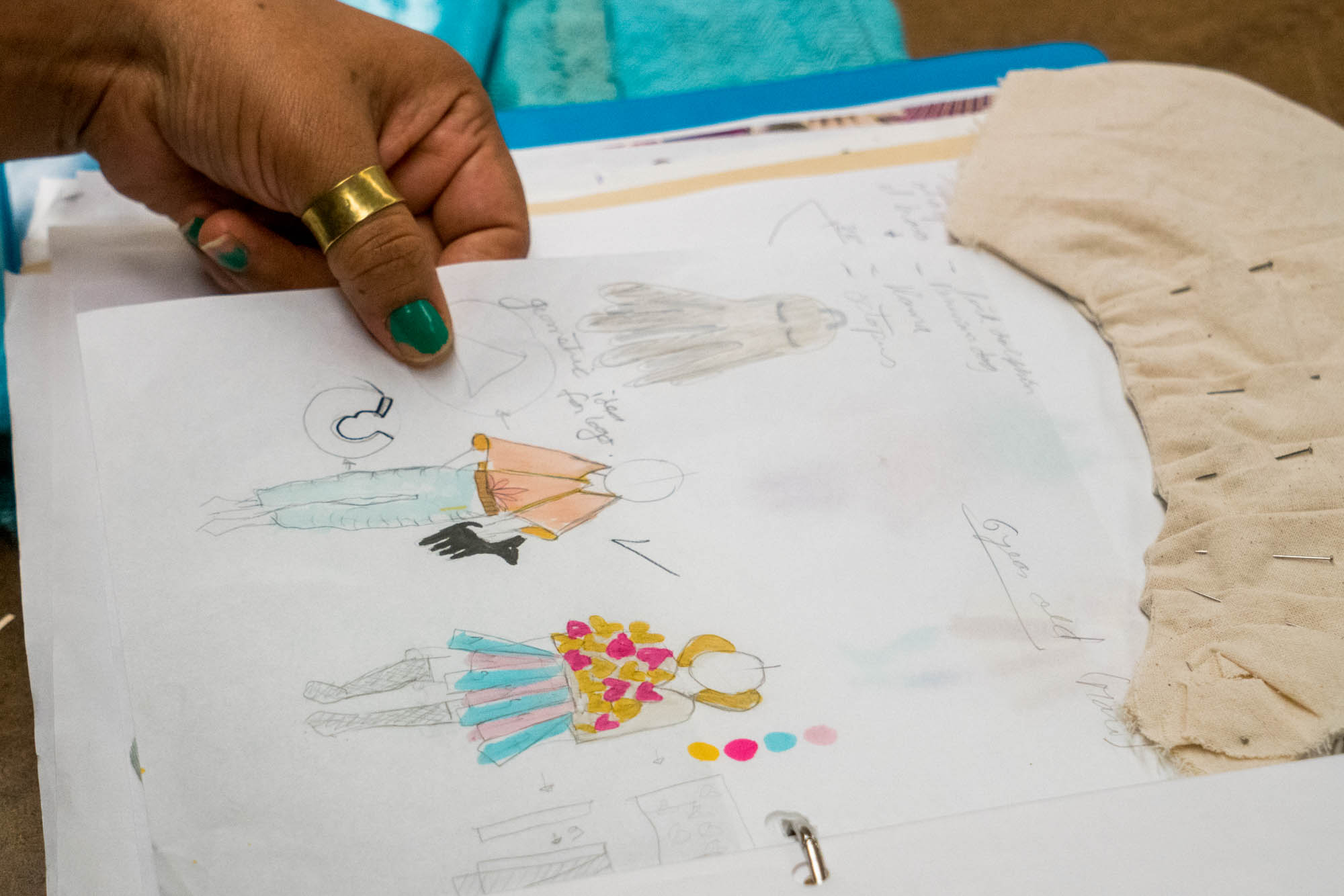 Leyla Vasquez looking over her design notebook. Photo by Rea Sohn/Corsair Contributor