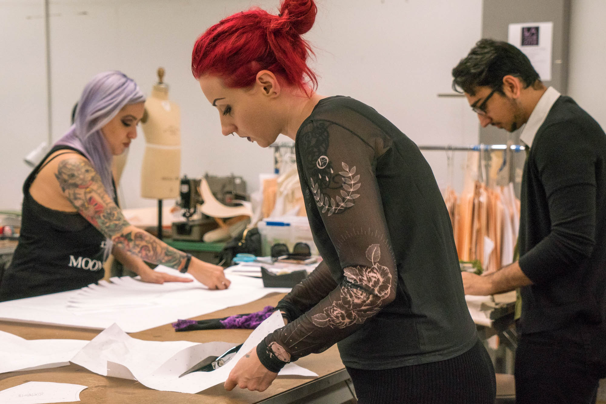  Abby Kahan, Shayan Pashai, and Sarah Lucier (left to right) working hard on their patterns. Photo by Rea Sohn/Corsair Contributor 