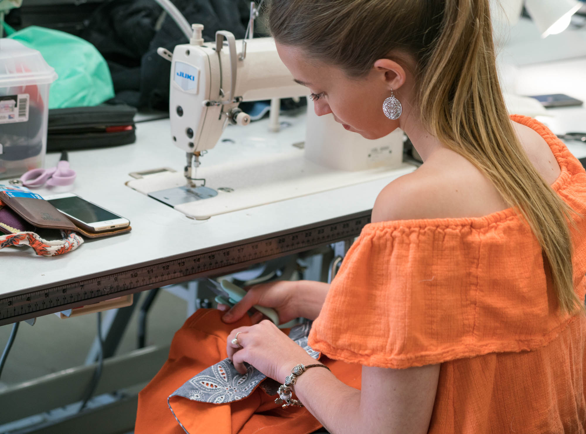  Emilie Geldreich doing a final touch of her jacket for the fashion show. Photo by Rea Sohn/Corsair Contributor 