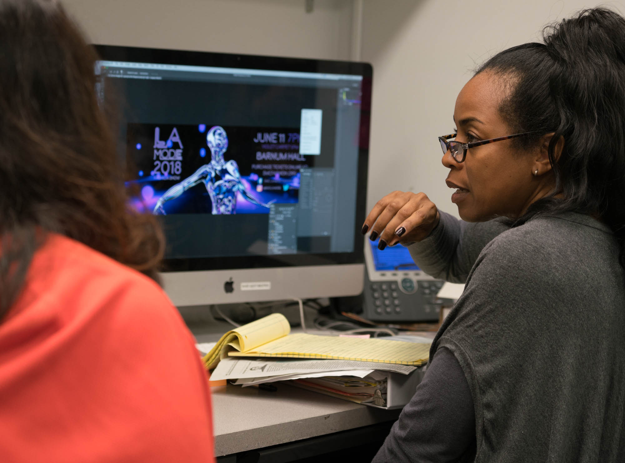 Prof. La Tanya Louis( left) and Tracy going over the billboard design layout. Photo by Rea Sohn/Corsair Contributor
