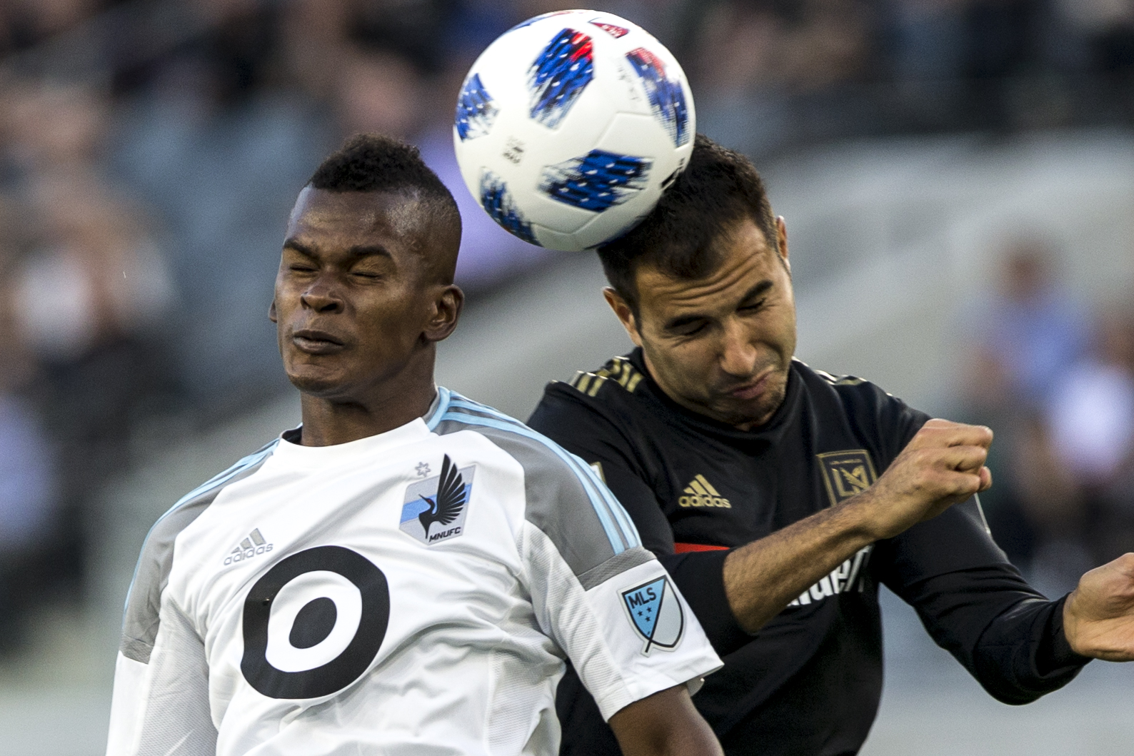  Minnesota United Football Club (MUFC) forward Darwin Quintero (left) battles for a header against Los Angeles Football Club (LAFC) defender Steven Beitashour (right) during their match at Banc of California Stadium on May 9, 2018 where the LAFC won 