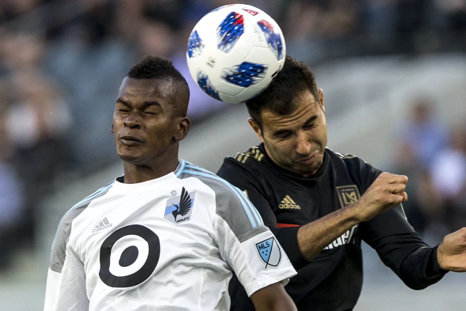 Minnesota United Football Club (MUFC) forward Darwin Quintero (left) battles for a header against Los Angeles Football Club (LAFC) defender Steven Beitashour (right) during their match at Banc of California Stadium on May 9, 2018 where the LAFC won 2-0. (Zane Meyer-Thornton/Corsair Photo)