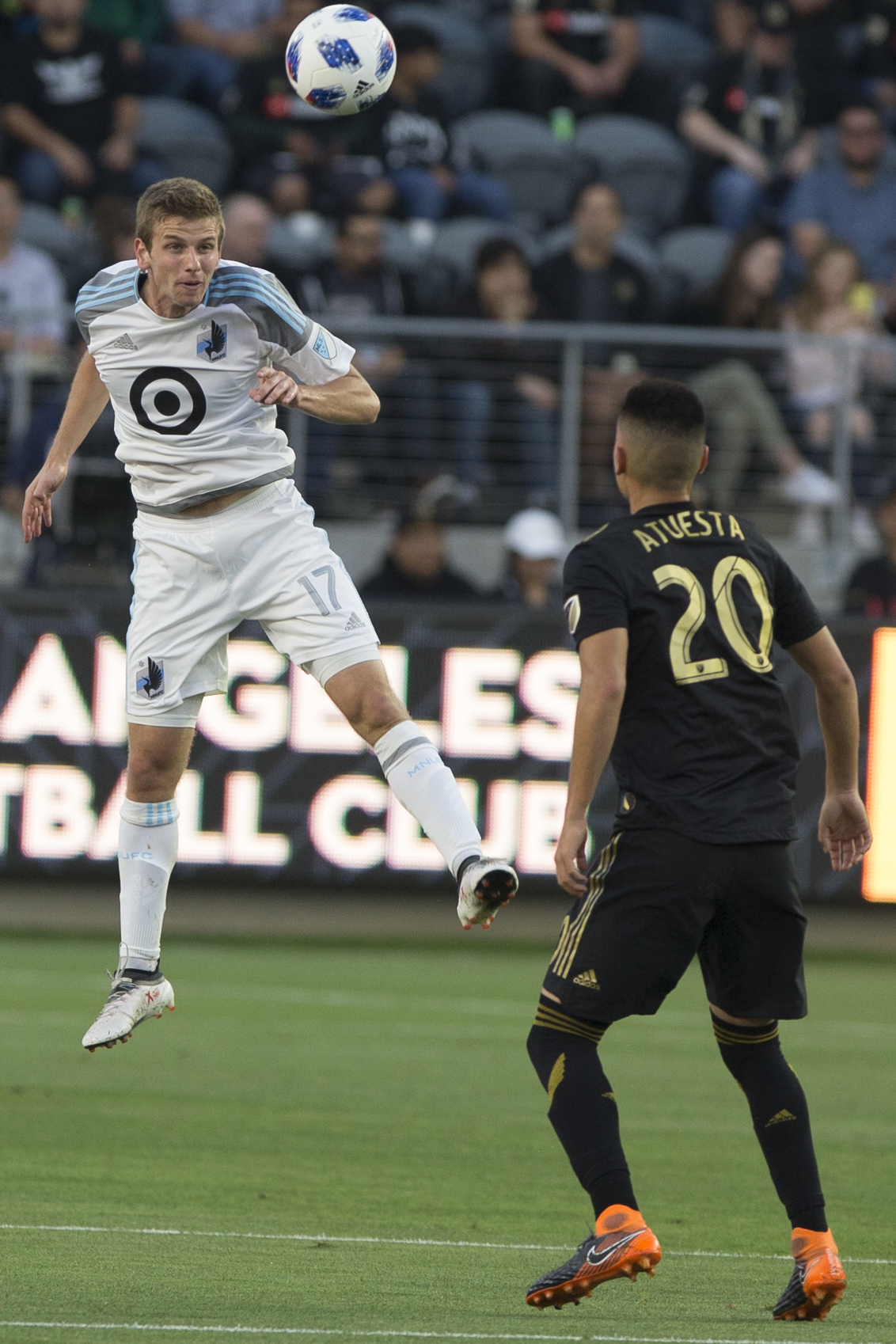  Minnesota United Football Club (MUFC) midfileder Collin Martin (17, left) goes for a header while Los Angeles Football Club (LAFC) midfielder Eduard Atuesta (20, right) anticipates where the ball will go during their match at Banc of California Stad