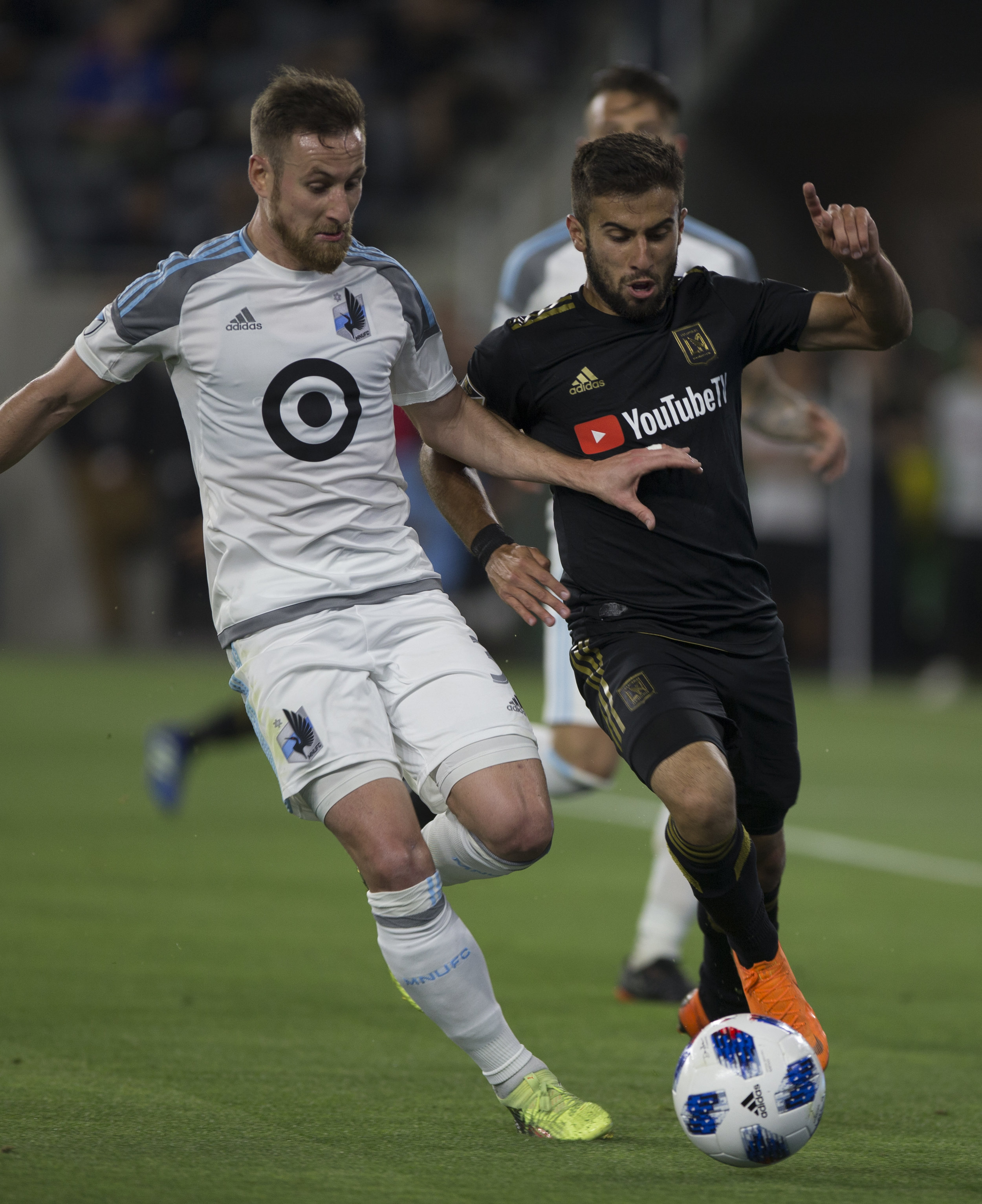  Minnesota United Football Club defender Jerome Thiesson (3, left) battles for the ball against Los Angeles Football Club forward Diego Rossi (9, right) during their match at Banc of California Stadium on May 9, 2018 where the LAFC won 2-0. (Zane Mey