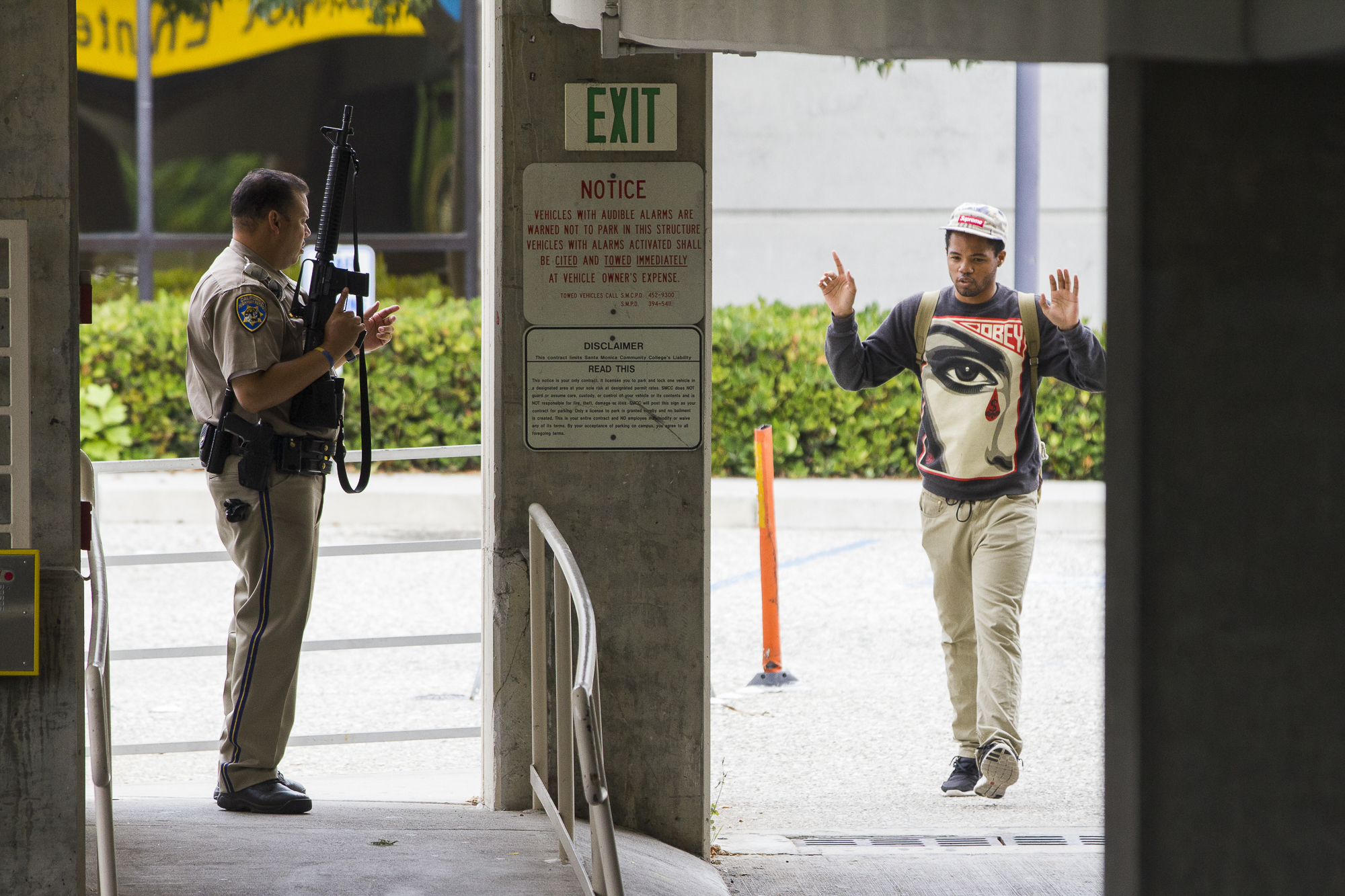  A student is evacuated from the business building on the campus of Santa Monica College by an armed California Highway Patrol officer (CHP) and then searched on June 13, 2013 in Santa Monica, California. (Jose Lopez/Corsair Contributor) 