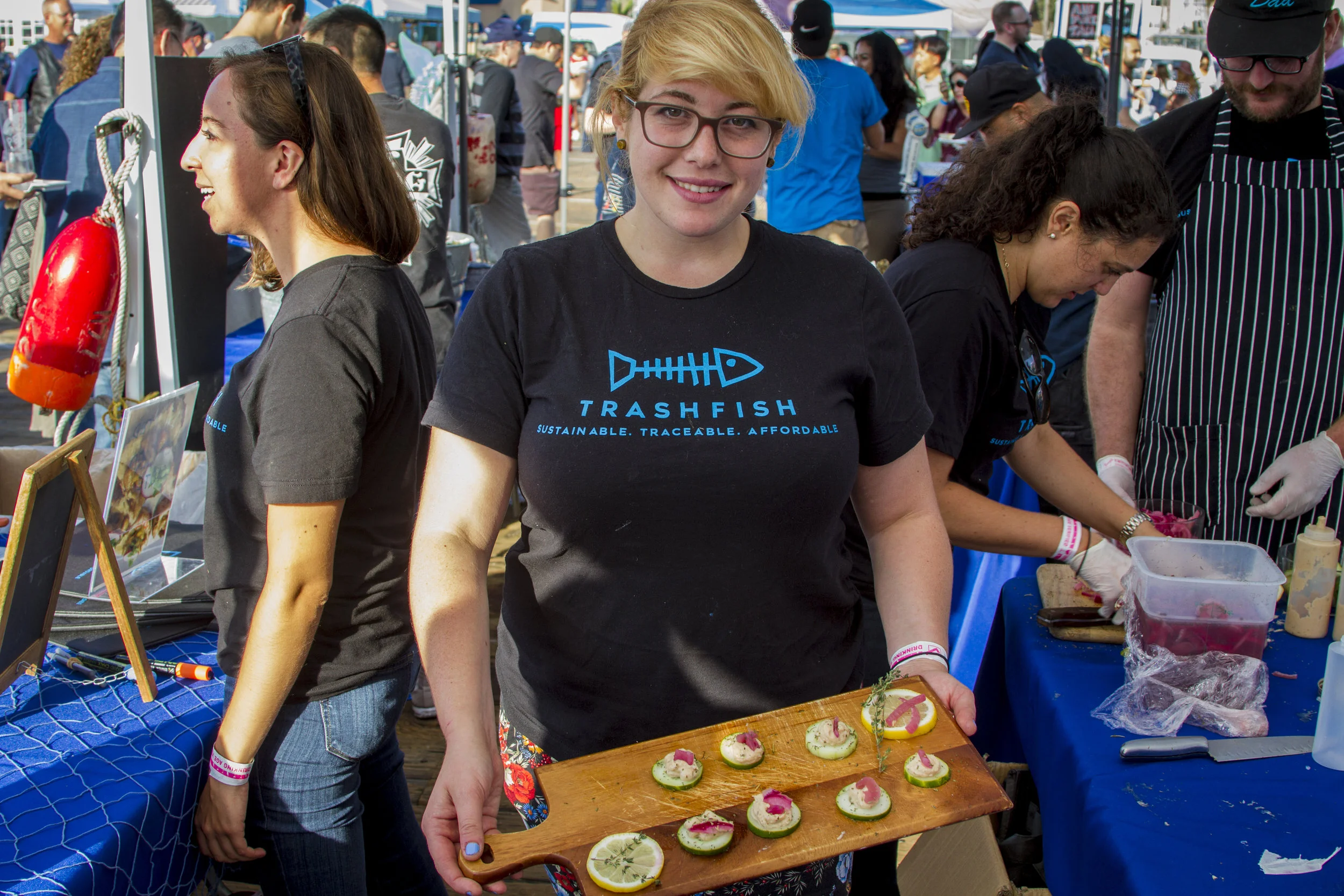 Ren Ostry shows off her petri cumcumber opah fish dish. At Off the Hook Seafood Festival. Oct. 6, 2018. By Yasser Marte.